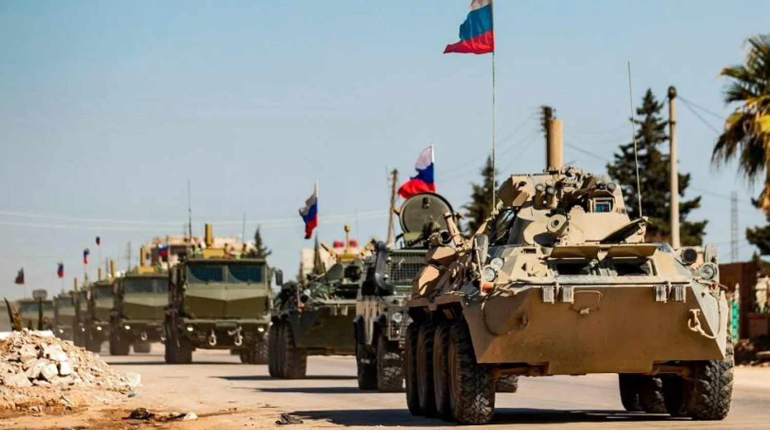 Russian military vehicles driving in a convoy from the town of Tal Tamr to Qamishli airport, in the city of Qamishli in Syria's northeastern Hasakeh province, March 9, 2020. (AFP)
