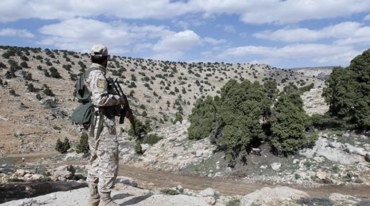 A Lebanese ‘Hezbollah’ militant carries his weapon as he stands in Khashaat, in the Qalamoun region on May 15, 2015. (Reuters)
