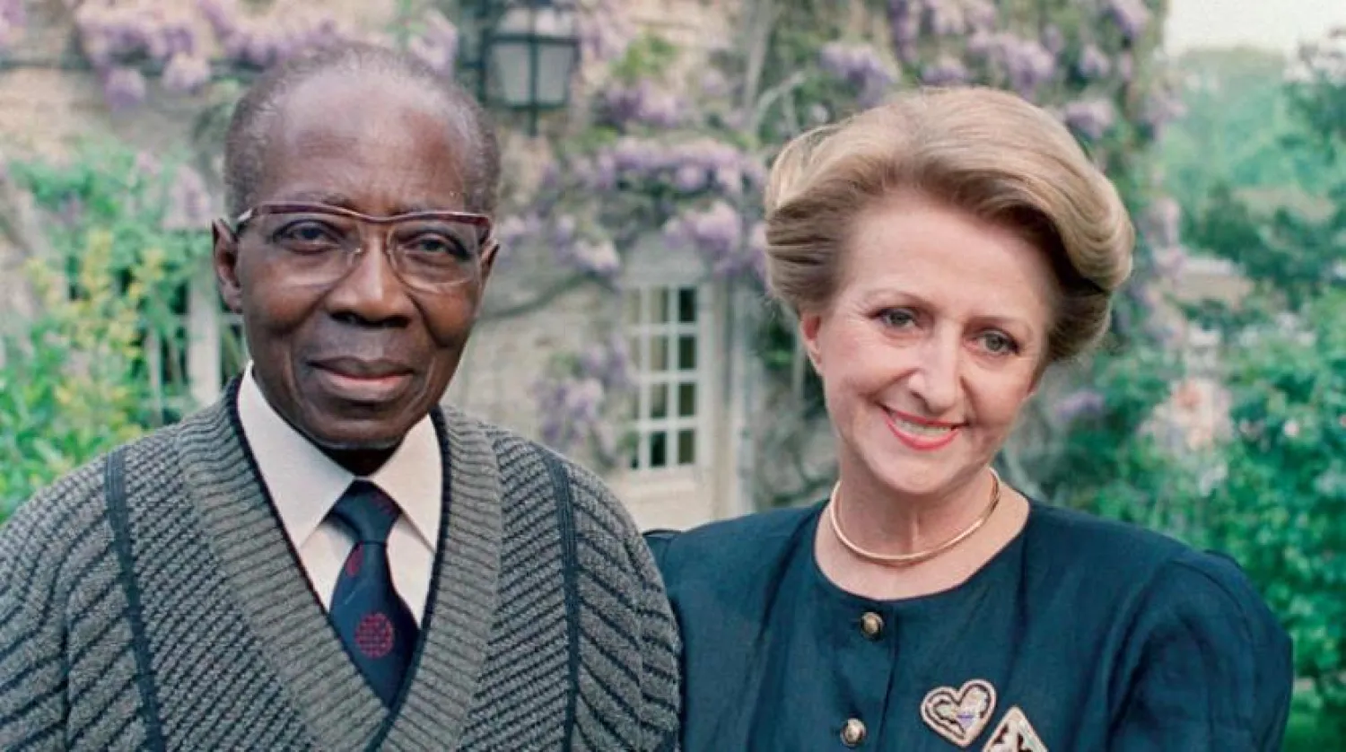 Leopold Sedar Senghor poses with his wife Colette in their garden in Verson. (AFP)