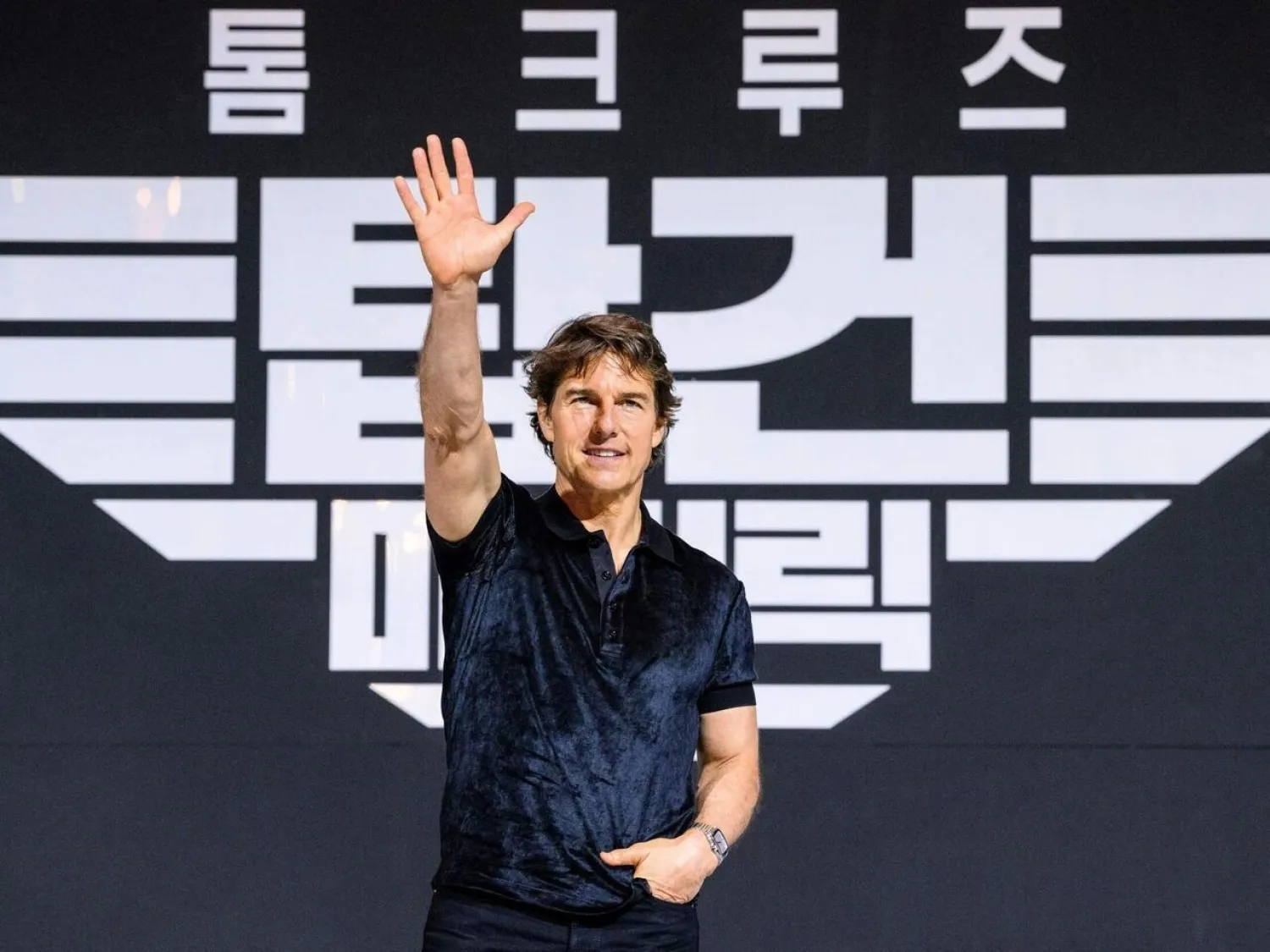 Actor Tom Cruise waves during a press conference in Seoul, South Korea for 'Top Gun: Maverick' on June 20, 2022 ANTHONY WALLACE AFP/File

