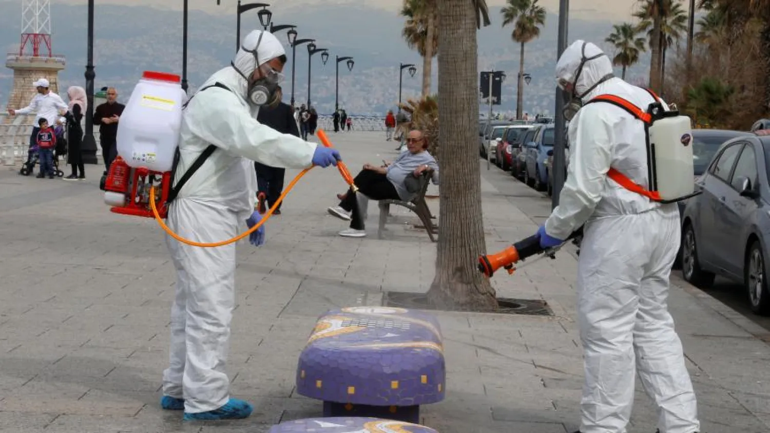 Employees from a disinfection company sanitize a bench as a precaution against the spread of the coronavirus, Beirut, Lebanon, March 5, 2020. REUTERS/Mohamed Azakir

