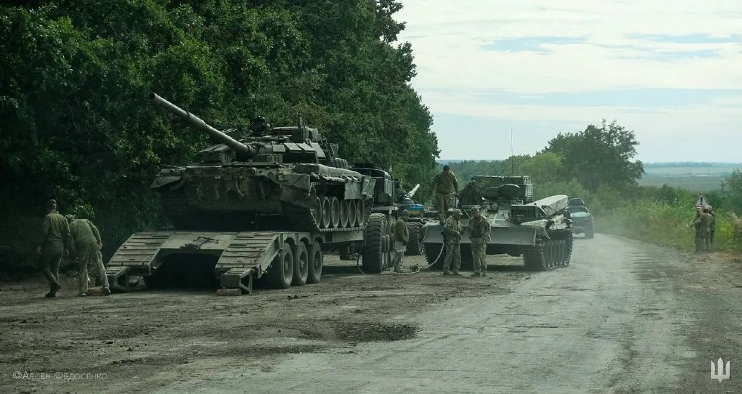 Ukrainian service members prepare to transport a Russian tank captured during a counteroffensive operation, amid Russia's attack on Ukraine, in Kharkiv region, Ukraine, in this handout picture released September 11, 2022. (Press service of the Commander-in-Chief of the Armed Forces of Ukraine/Handout via Reuters)