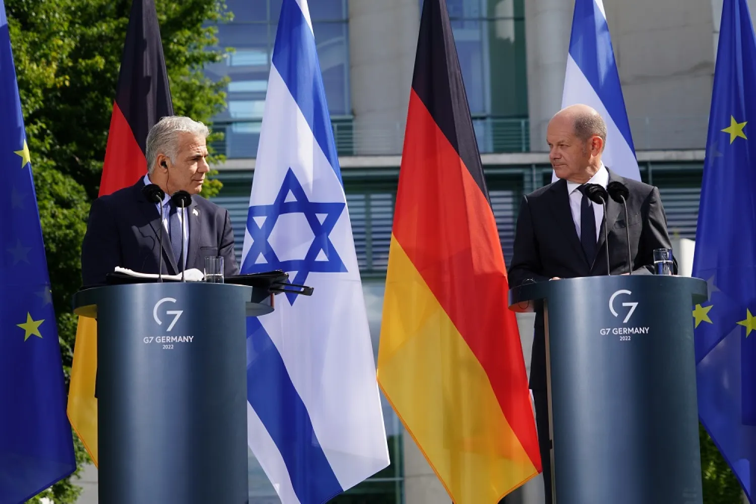 Israeli Prime Minister Yair Lapid (L) speaks next to German Chancellor Olaf Scholz (R) during a joint press conference at the chancellery in Berlin, Germany, 12 September 2022. (EPA)