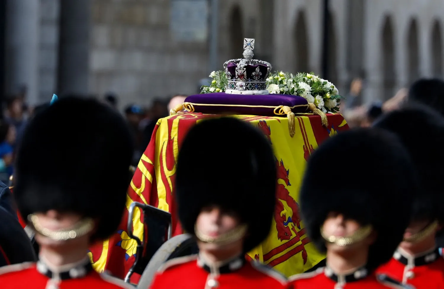 The Imperial State Crown is seen on the coffin of Queen Elizabeth II, adorned with a Royal Standard and the Imperial State Crown and pulled by a Gun Carriage of The King's Troop Royal Horse Artillery, during a procession from Buckingham Palace to the Palace of Westminster, in London on September 14, 2022. (AFP)