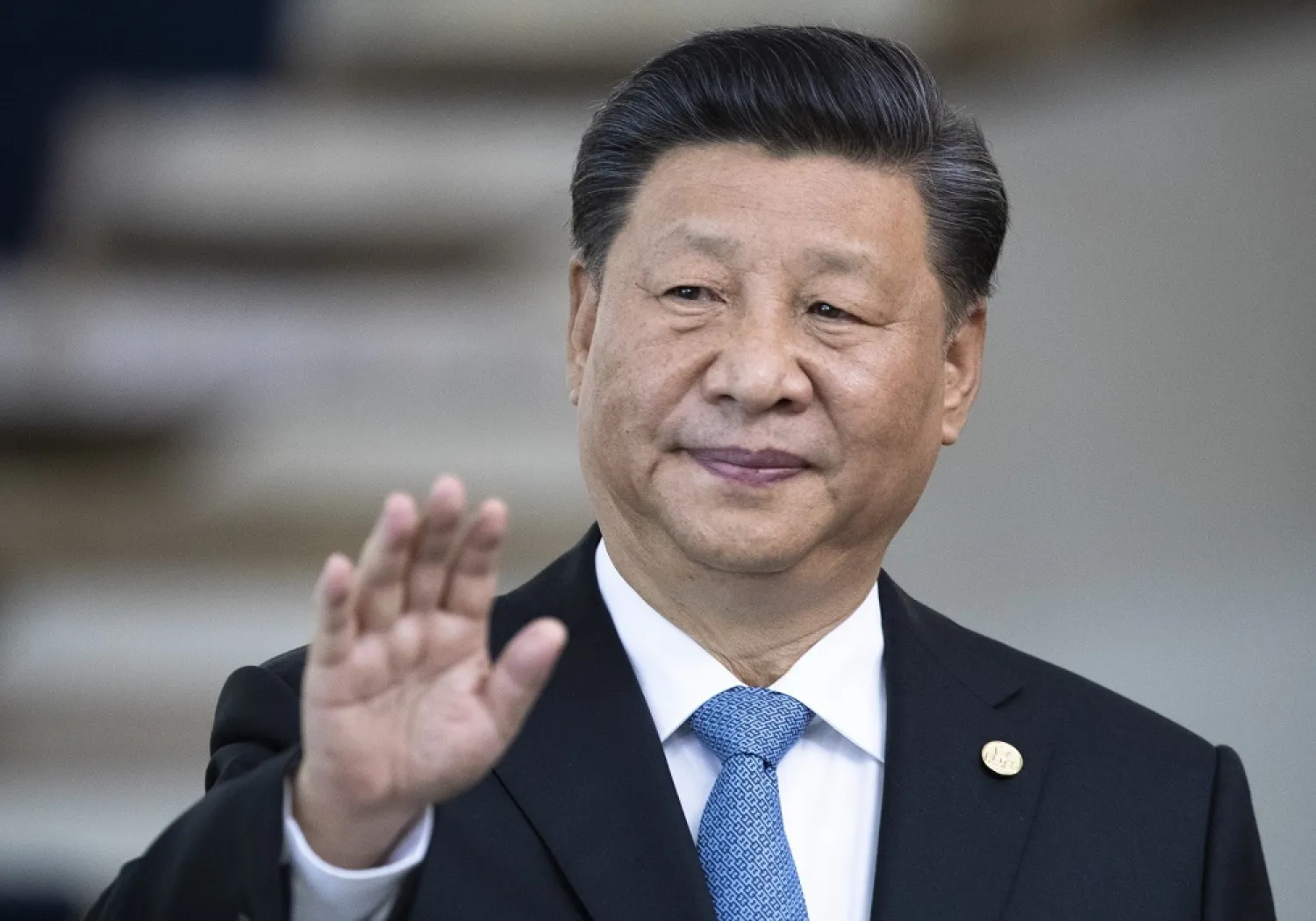 China's President Xi Jinping greets the media prior to a meeting of leaders of the BRICS emerging economies at the Itamaraty palace in Brasilia, Brazil, on Nov. 14, 2019. (AP)