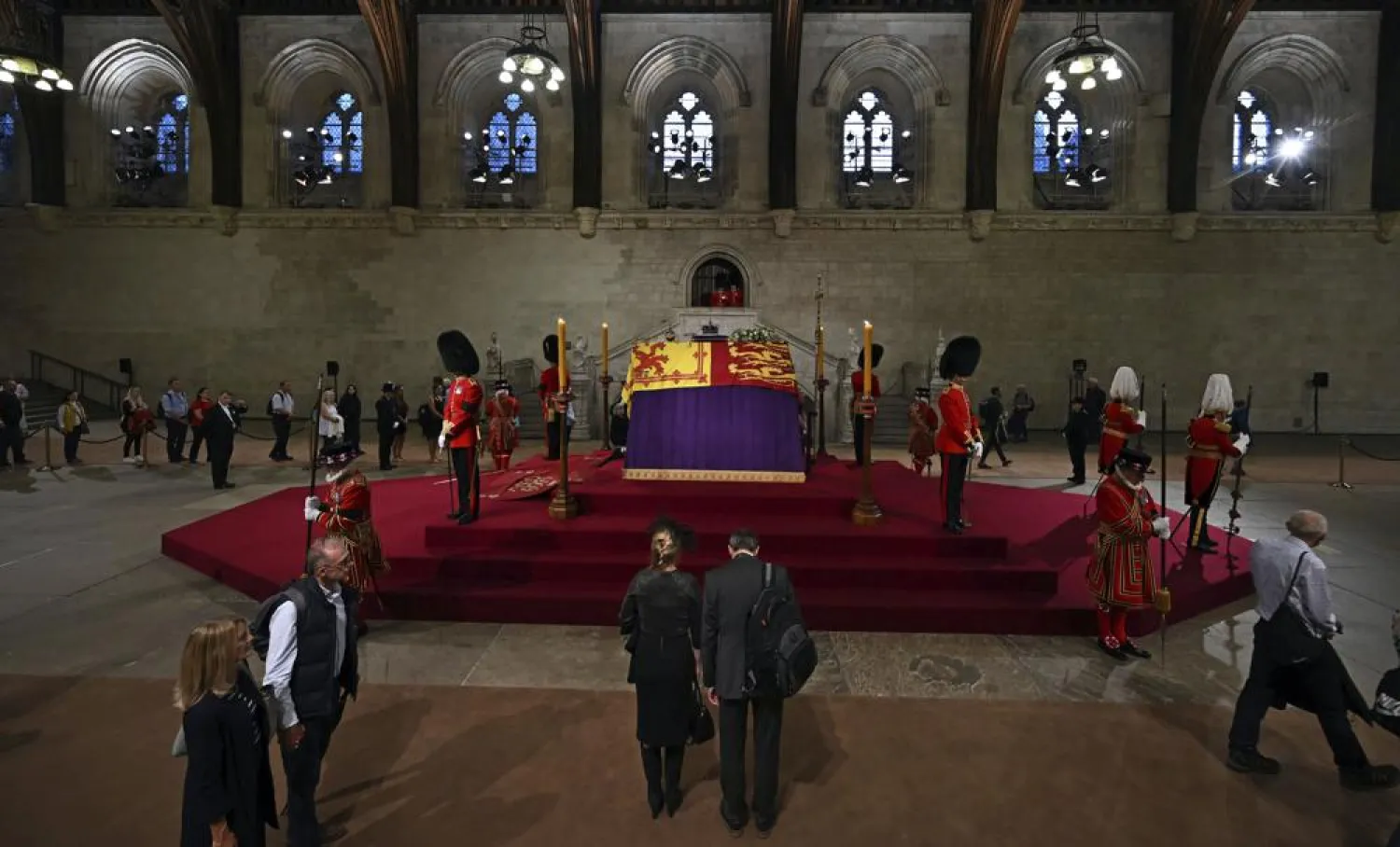Members of the public file past the coffin of Queen Elizabeth II, inside Westminster Hall, at the Palace of Westminster, in London Wednesday, Sept. 14, 2022, where it Lies in State on a Catafalque. (Ben Stansall/Pool Photo via AP)

