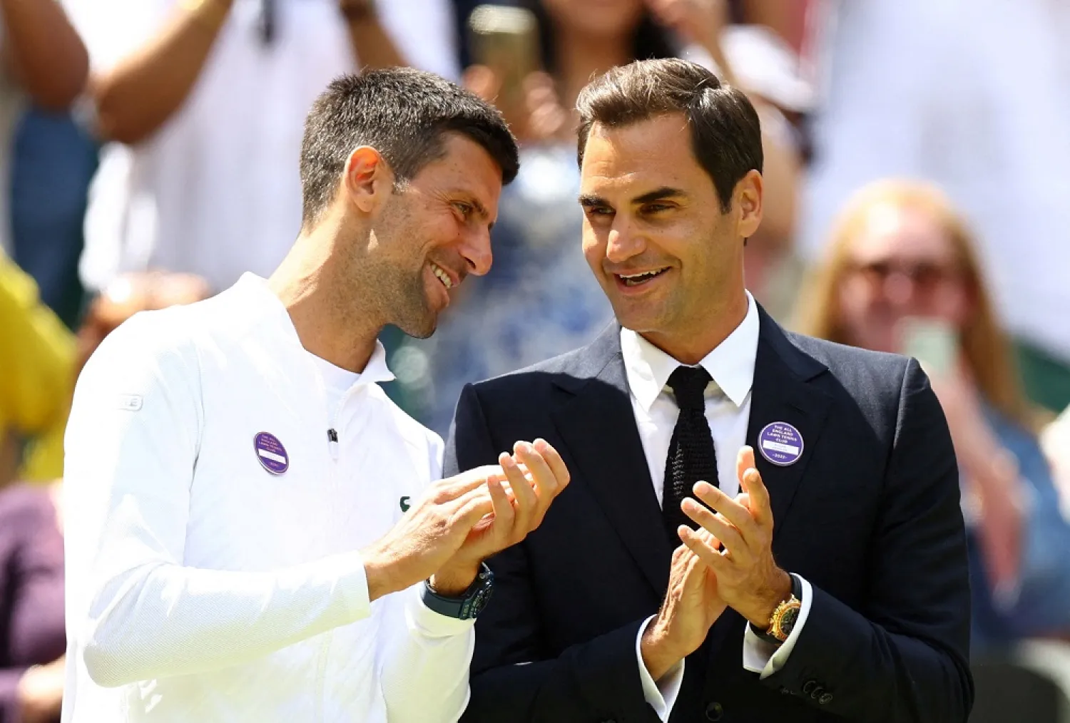 Tennis - Wimbledon - All England Lawn Tennis and Croquet Club, London, Britain - July 3, 2022 Serbia's Novak Djokovic and Switzerland's Roger Federer are seen during center court centenary celebrations. (Reuters)