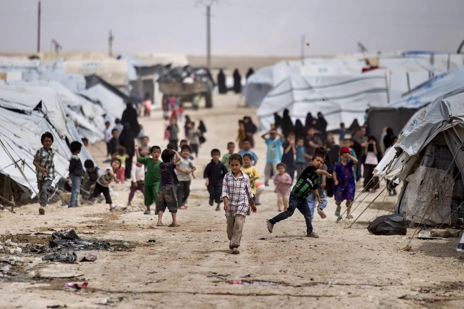 Children gather outside their tents, at al-Hol camp, which houses families of members of the ISIS group, in Hassakeh province, Syria, May 1, 2021. (AP)