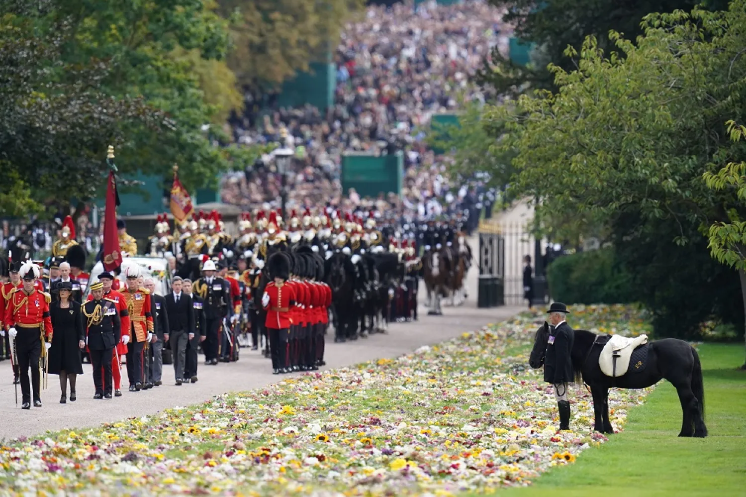 Emma, the monarch's fell pony, stands as the Ceremonial Procession of the coffin of Queen Elizabeth II arrives at Windsor Castle for the Committal Service at St George's Chapel, Monday Sept. 19, 2022. (AP)