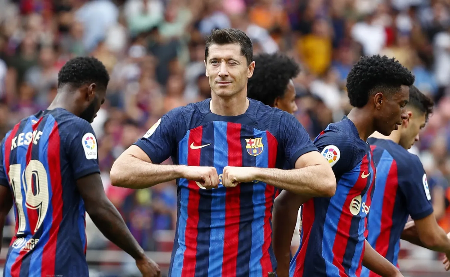 Barcelona's Robert Lewandowski celebrates after scoring the opening goal during a Spanish LaLiga match between FC Barcelona and Elche CF at Camp Nou stadium in Barcelona, Spain, Saturday, Sept. 17, 2022. (AP)