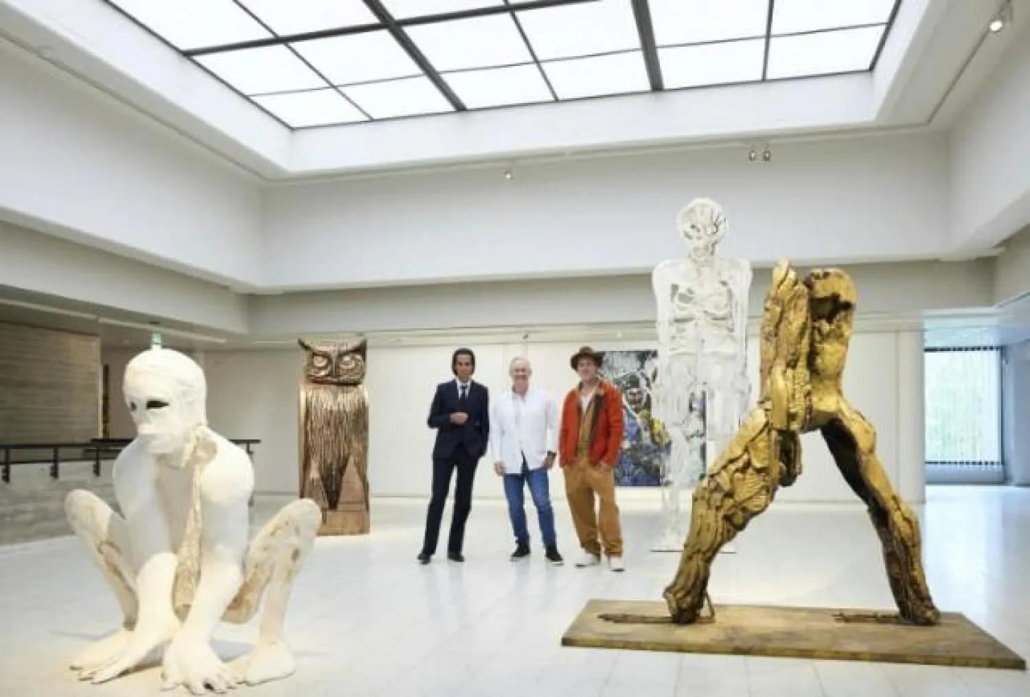 British-born artist Thomas Houseago (C) displays works alongside Nick Cave (L) and Brad Pitt (R) at the exhibition in Tampere Jussi KOIVUNEN LEHTIKUVA/AFP
