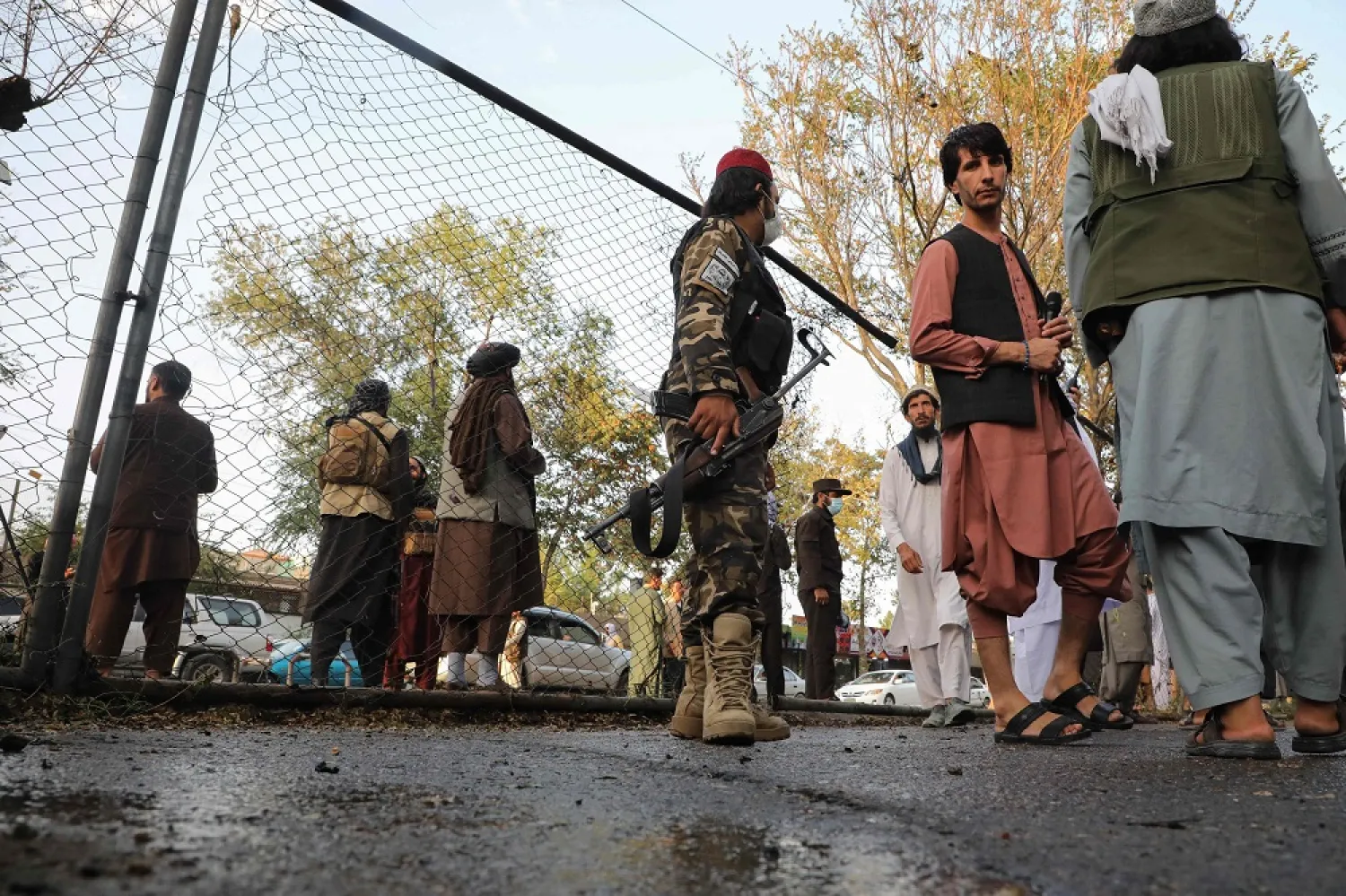 Taliban fighters investigate at a site after a blast near the Wazir Akbar Khan Mosque that reportedly happened as people were leaving the mosque after Friday prayers at Wazir Akbar Khan in Kabul on September 23, 2022. (AFP)