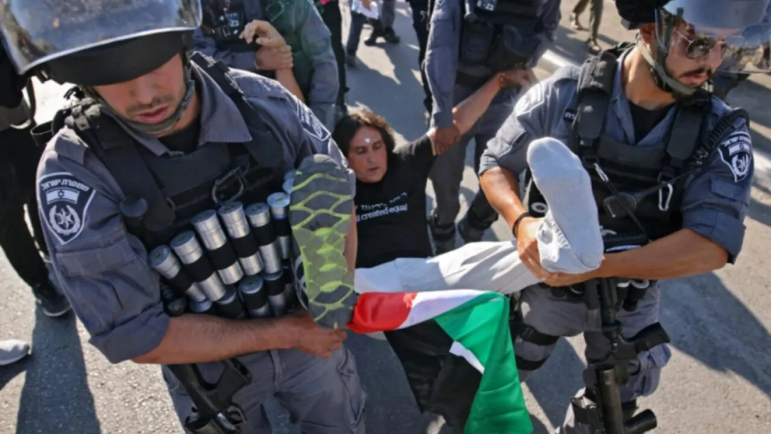 Israeli forces arrest an activist in occupied East Jerusalem, June 25, 2021. Photo: AFP