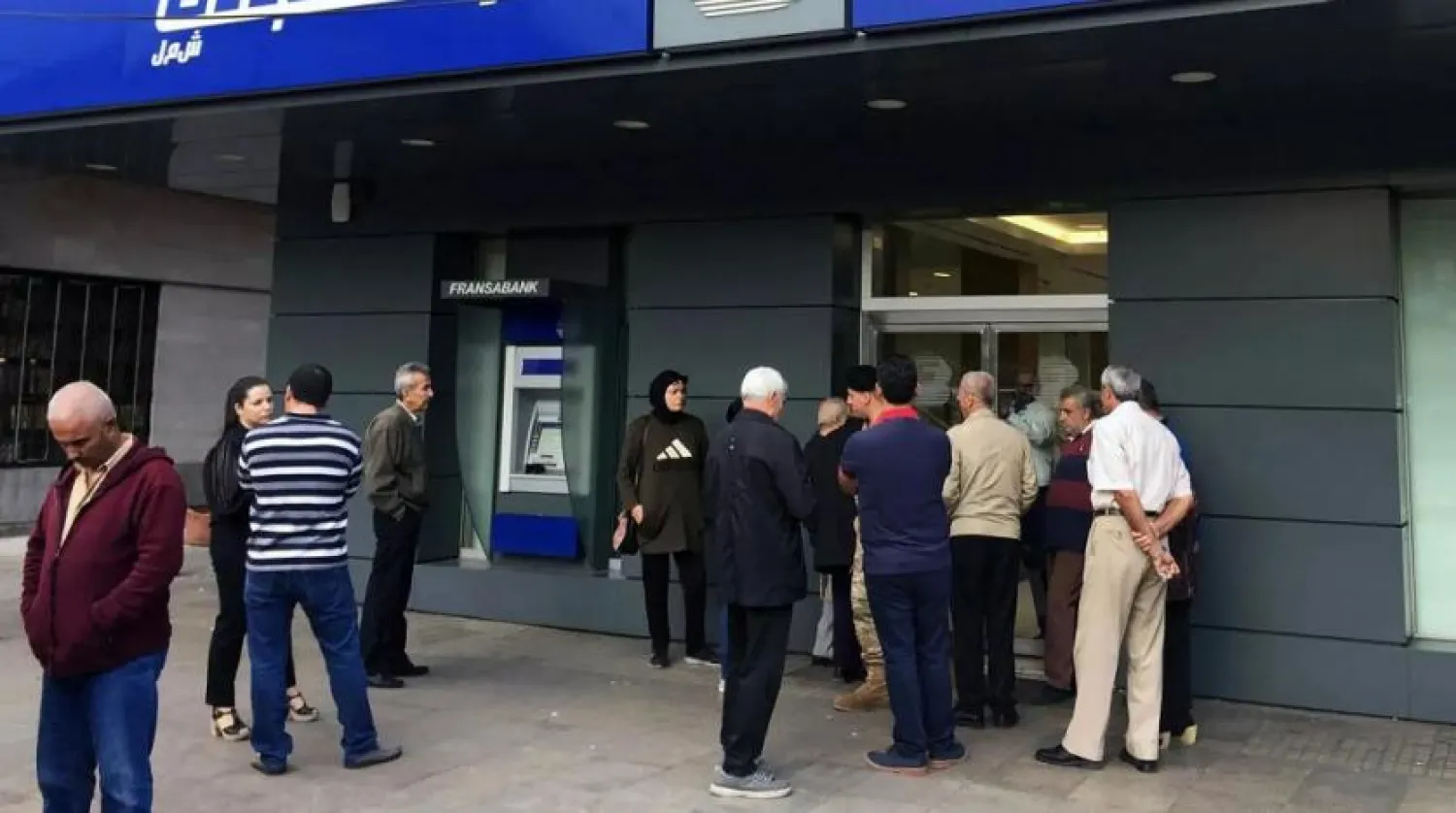 People queue outside a bank in Tripoli, Lebanon November 1, 2019. (Reuters)

