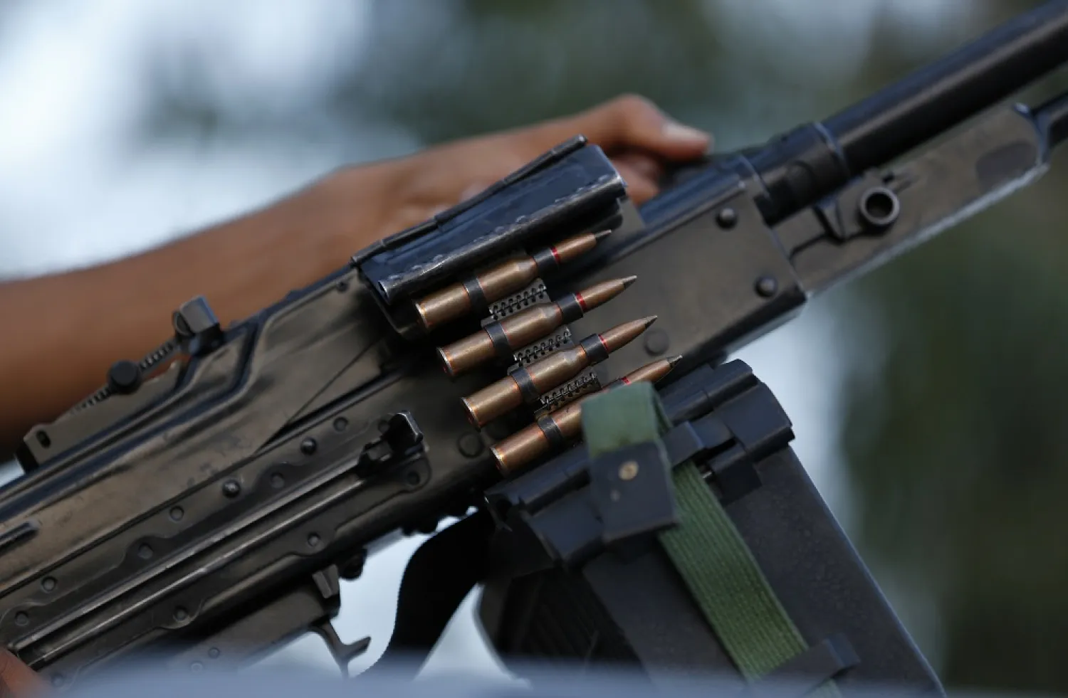 A soldier from forces loyal to Prime Minister Abdul Hamid al-Dbeibah holds his weapon as he patrols on a street in Tripoli, Libya, Monday, Sept. 5, 2022. (AP)