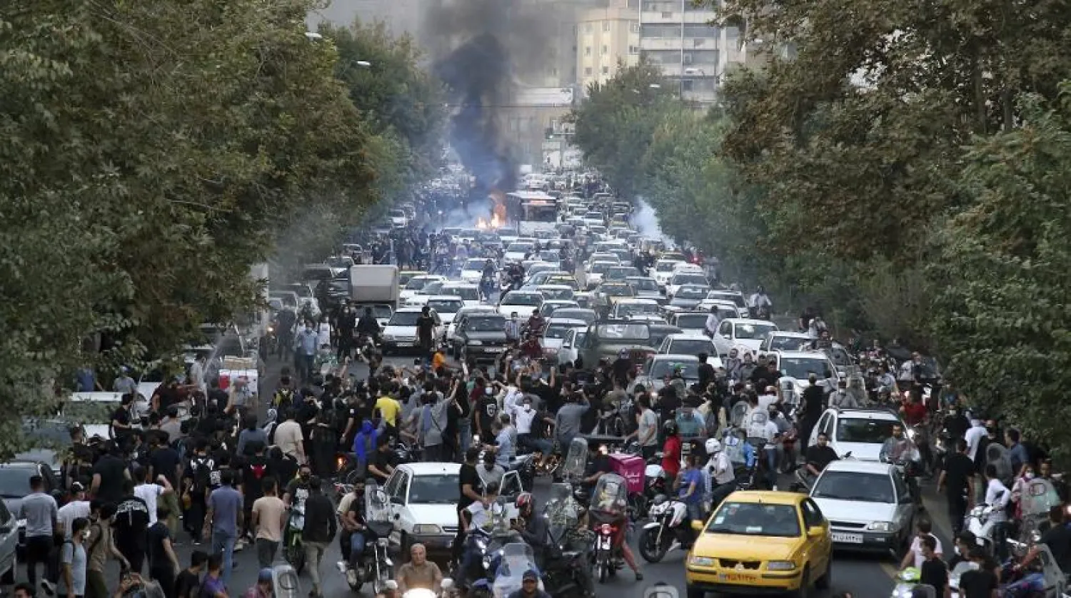In this photo taken by an individual not employed by The Associated Press and obtained by the AP outside Iran, protesters chant slogans during a protest over the death of a woman who was detained by the morality police, in downtown Tehran, Iran, Sept. 21, 2022. (AP)
