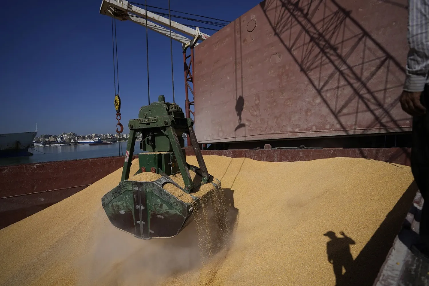 Trucks being filled with Ukrainian corn from the ship AK Ambition, sailing under the flag of Panama at Tripoli seaport, in Tripoli, north Lebanon, Monday, Sept. 26, 2022. (AP)