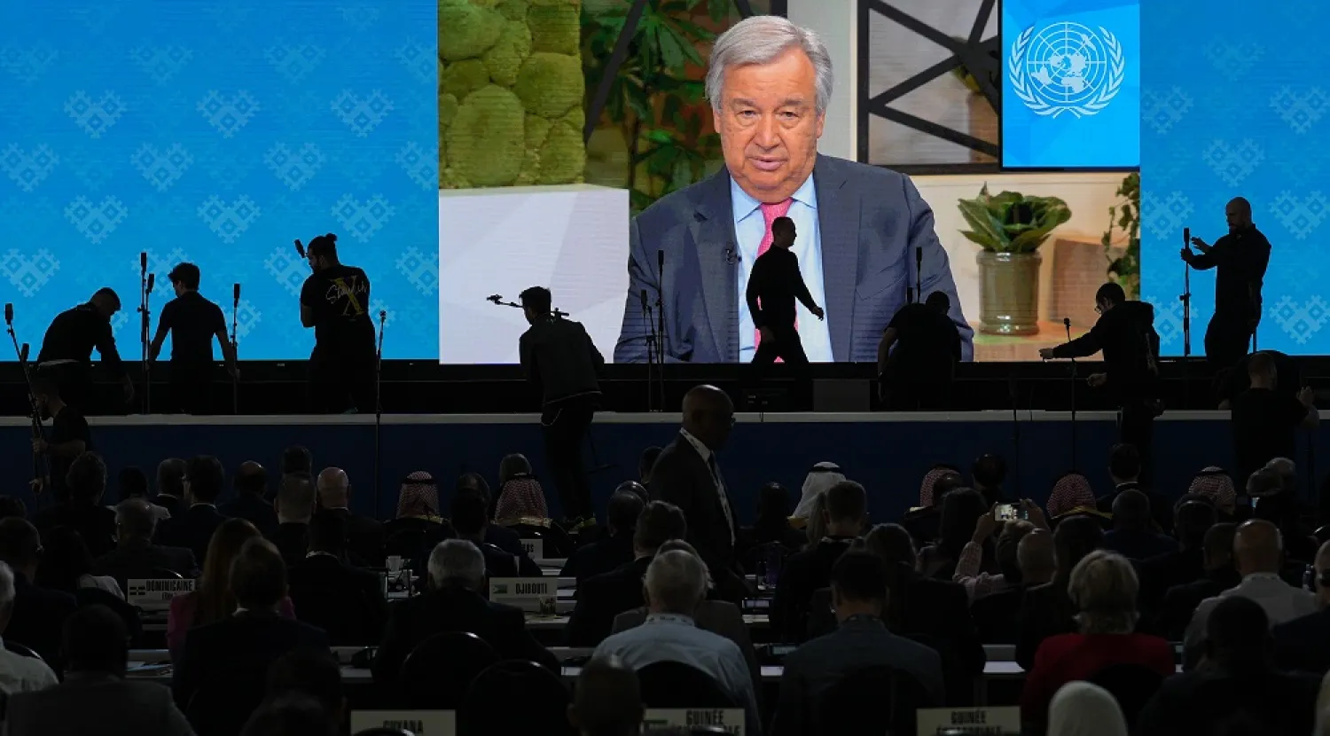 Participants watch a recorded message from United Nations Secretary-General Antonio Guterres during the opening session of the International Telecommunication Union (ITU), the United Nations specialized agency for information and communication technologies, in Bucharest, Romania, Monday, Sept. 26, 2022. (AP)
