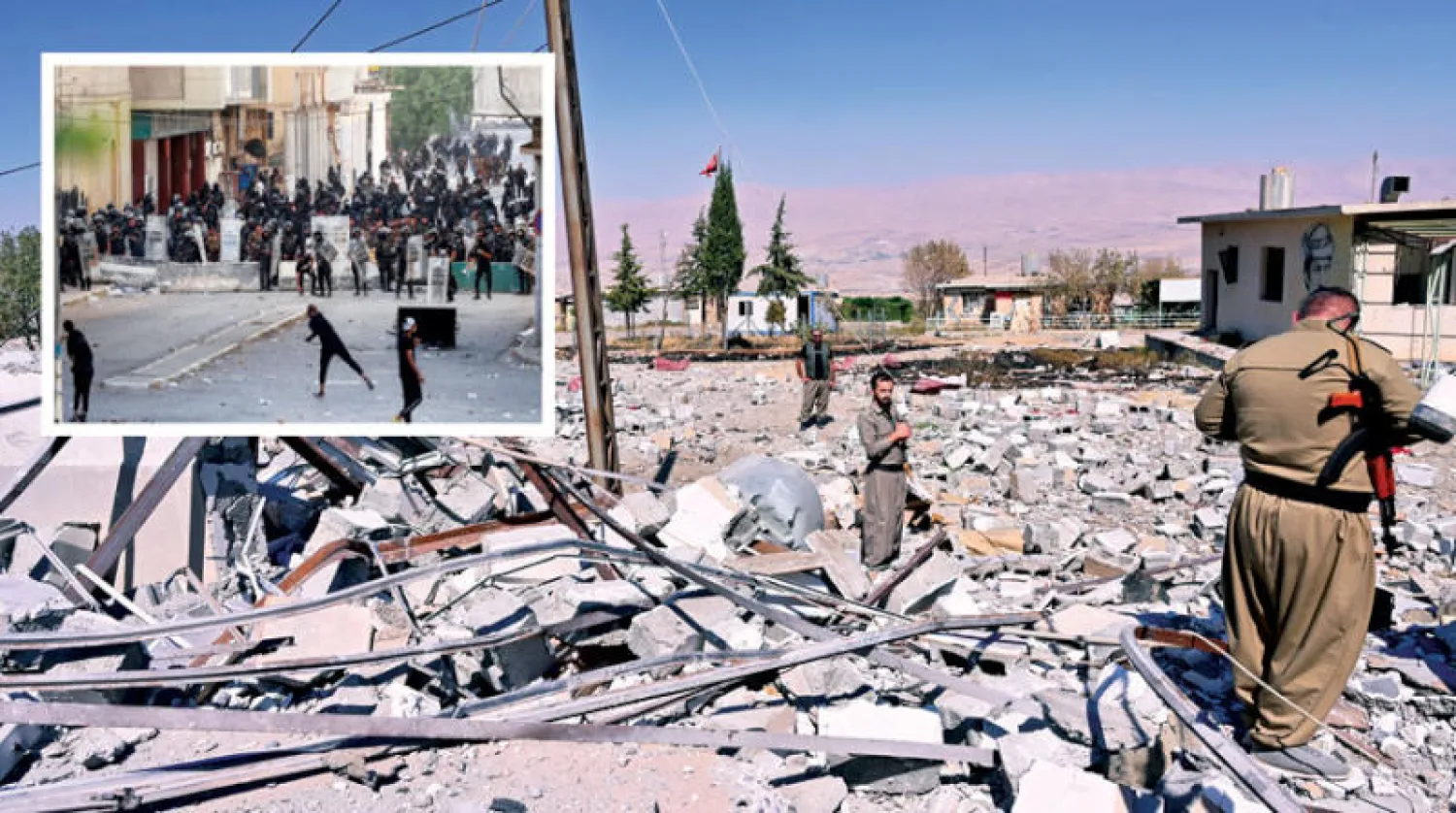 مقاتلون يعاينون آثار القصف الإيراني على السليمانية في كردستان العراق أمس (إ.ب.أ)... وفي الإطار مظاهرات احتجاجية في بغداد أمس (رويترز)