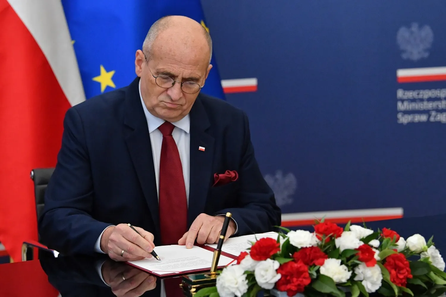 Polish Foreign Minister Zbigniew Rau attends a press conference at the headquarters of the Polish Foreign Ministry in Warsaw, Poland, 03 October 2022. (EPA)
