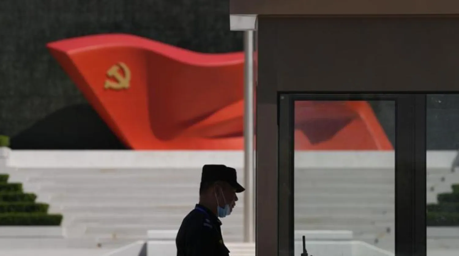 FILE - A security guard stands near a sculpture of the Chinese Communist Party flag at the Museum of the Communist Party of China on May 26, 2022, in Beijing. (AP Photo/Ng Han Guan, File)
