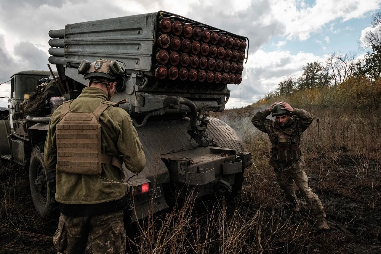 Ukrainian soldiers prepare to fire a BM-21 Grad multiple rocket launcher towards Russian positions in Kharkiv region on October 4, 2022. (AFP)