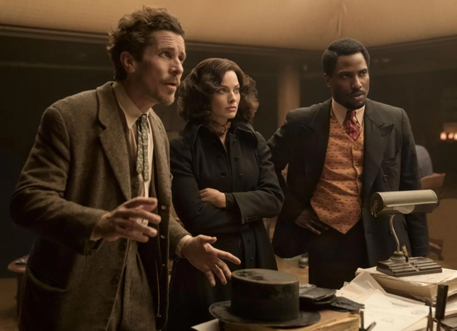 This image released by 20th Century Studios shows, from left, Christian Bale, Margot Robbie and John David Washington in a scene from "Amsterdam." (20th Century Studios via AP)