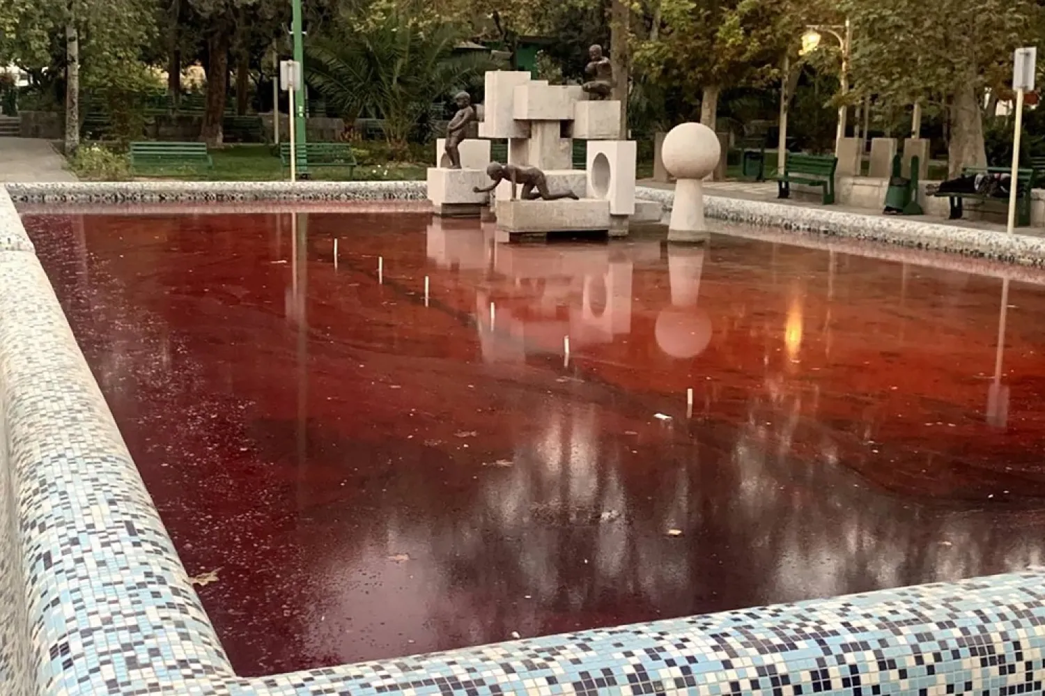 This UGC image made available on twitter on October 7, 2022 shows the fountain of Park Daneshjoo or Student Park in the Iranian capital Tehran reportedly colored red in protest against a bloody crackdown on three weeks of protests sparked by the death in custody of Mahsa Amini. (UGC/AFP)