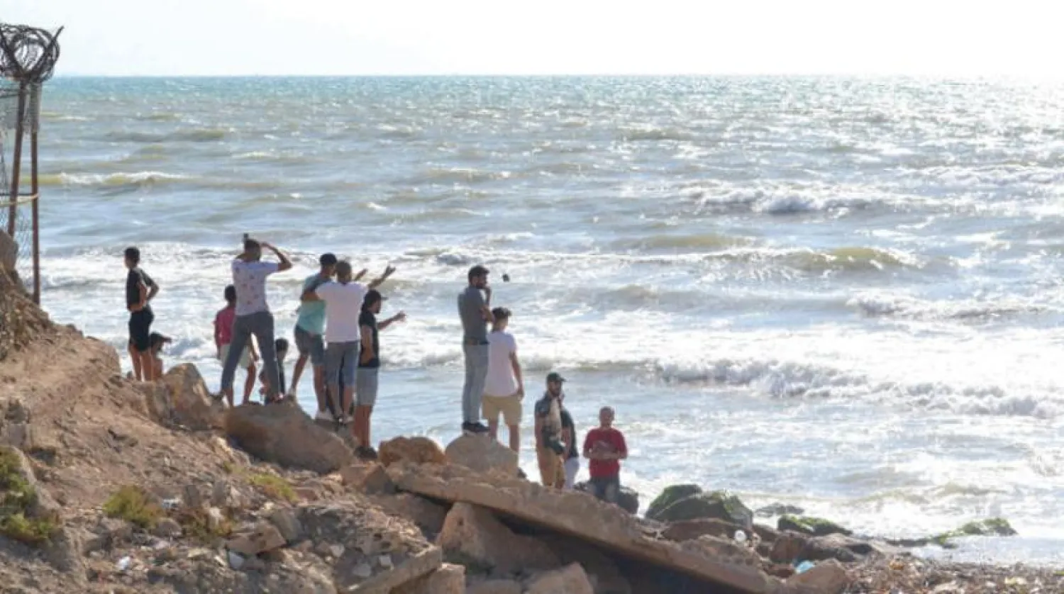 Lebanese people await survivors or victims of a boat sinking off the Arida crossing with Syria. (AFP) 