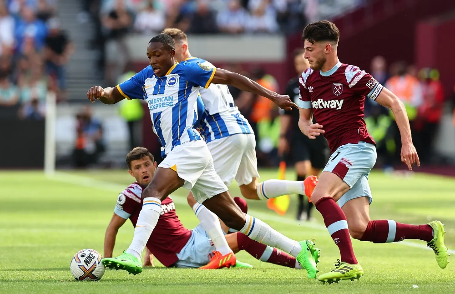 Football - Premier League - West Ham United v Brighton & Hove Albion - London Stadium, London, Britain - August 21, 2022 Brighton & Hove Albion's Enock Mwepu in action with West Ham United's Declan Rice and Aaron Cresswell. (Reuters)