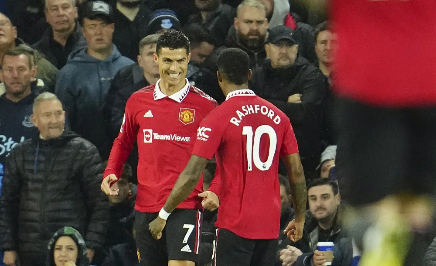 Manchester United's Cristiano Ronaldo, left, celebrates with teammate Marcus Rashford after scoring his side's second goal during the Premier League match between Everton and Manchester United at Goodison Park, in Liverpool, England, Sunday Oct. 9, 2022. (AP)