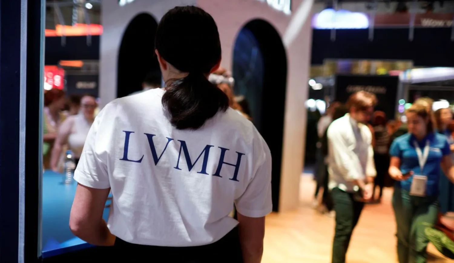 An exhibitor wears a LVMH t-shirt at their booth, at the Viva Technology conference dedicated to innovation and startups, at the Porte de Versailles exhibition center in Paris, France June 17, 2022. REUTERS/Benoit Tessier/File Photo
