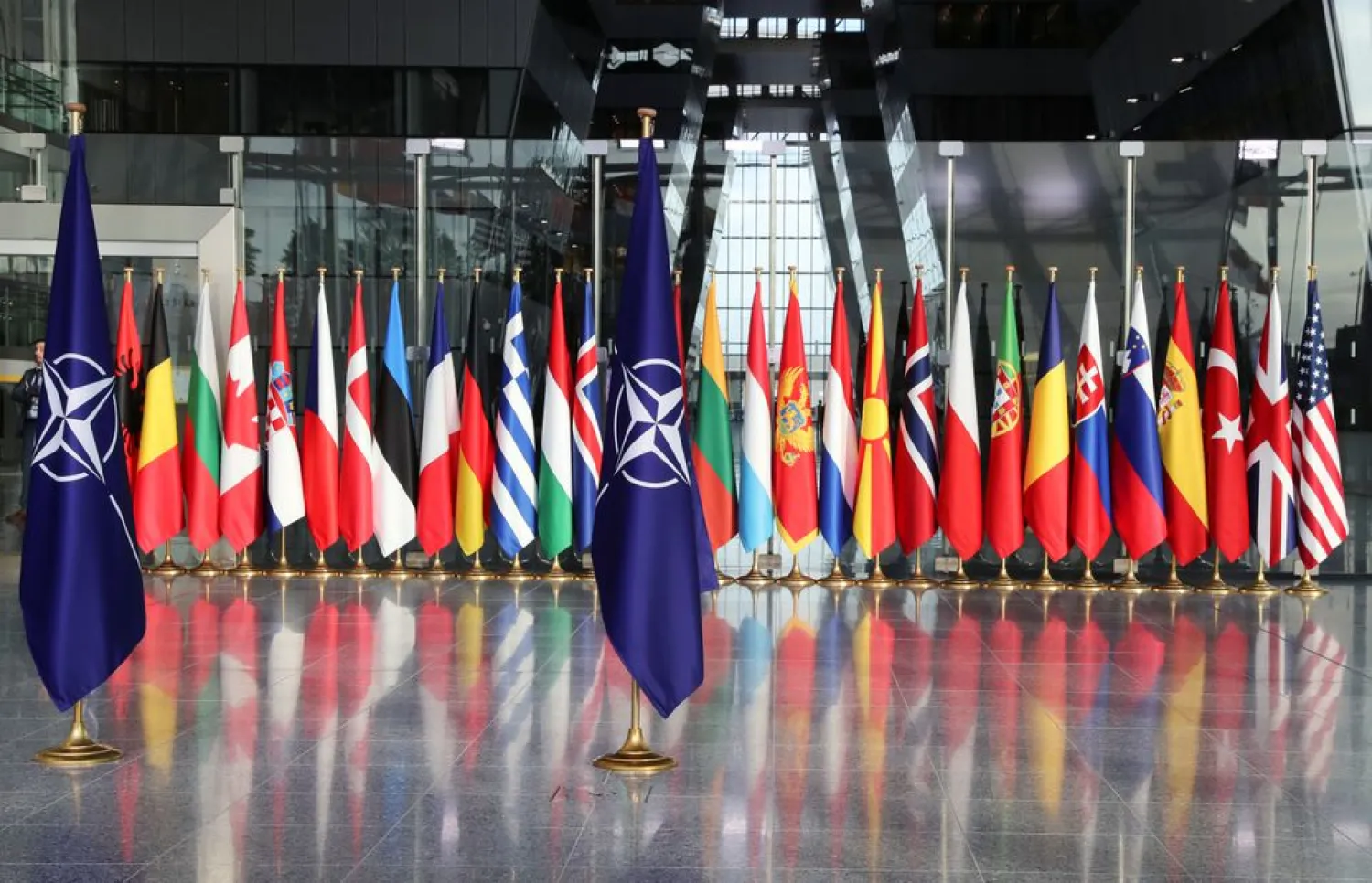 Flags are seen ahead of a NATO Defense Ministers meeting at the Alliance headquarters in Brussels, Belgium, October 21, 2021. REUTERS/Pascal Rossignol