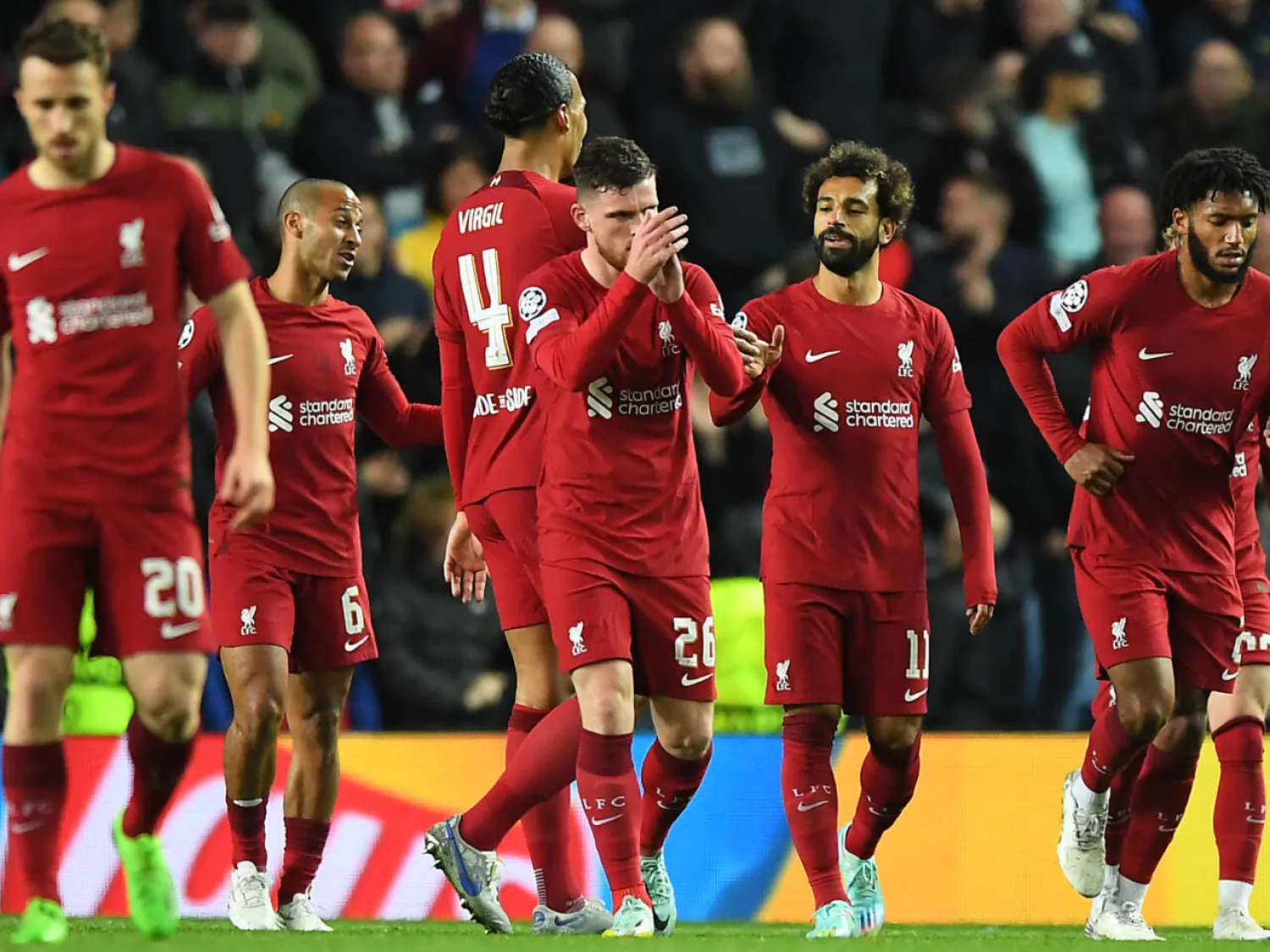 Mohamed Salah (2nd right) scored the fastest hat-trick in Champions League history against Rangers ANDY BUCHANAN AFP
