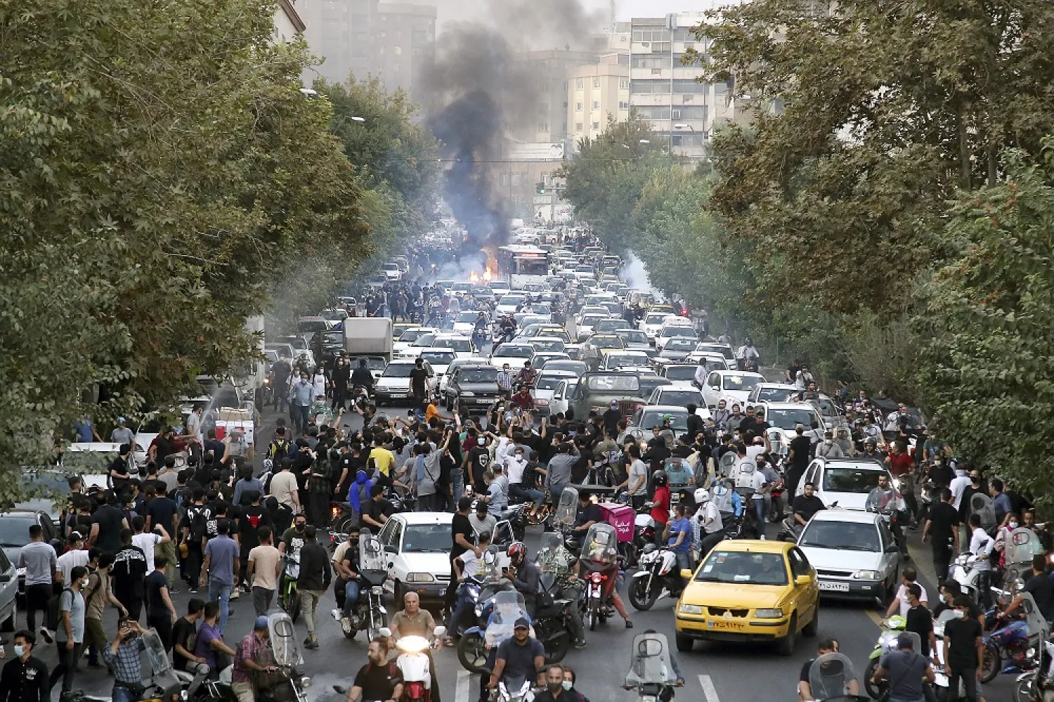 In this photo taken by an individual not employed by the Associated Press and obtained by the AP outside Iran, protesters chant slogans during a protest over the death of a woman who was detained by the morality police, in downtown Tehran, Iran, Sept. 21, 2022. (AP)