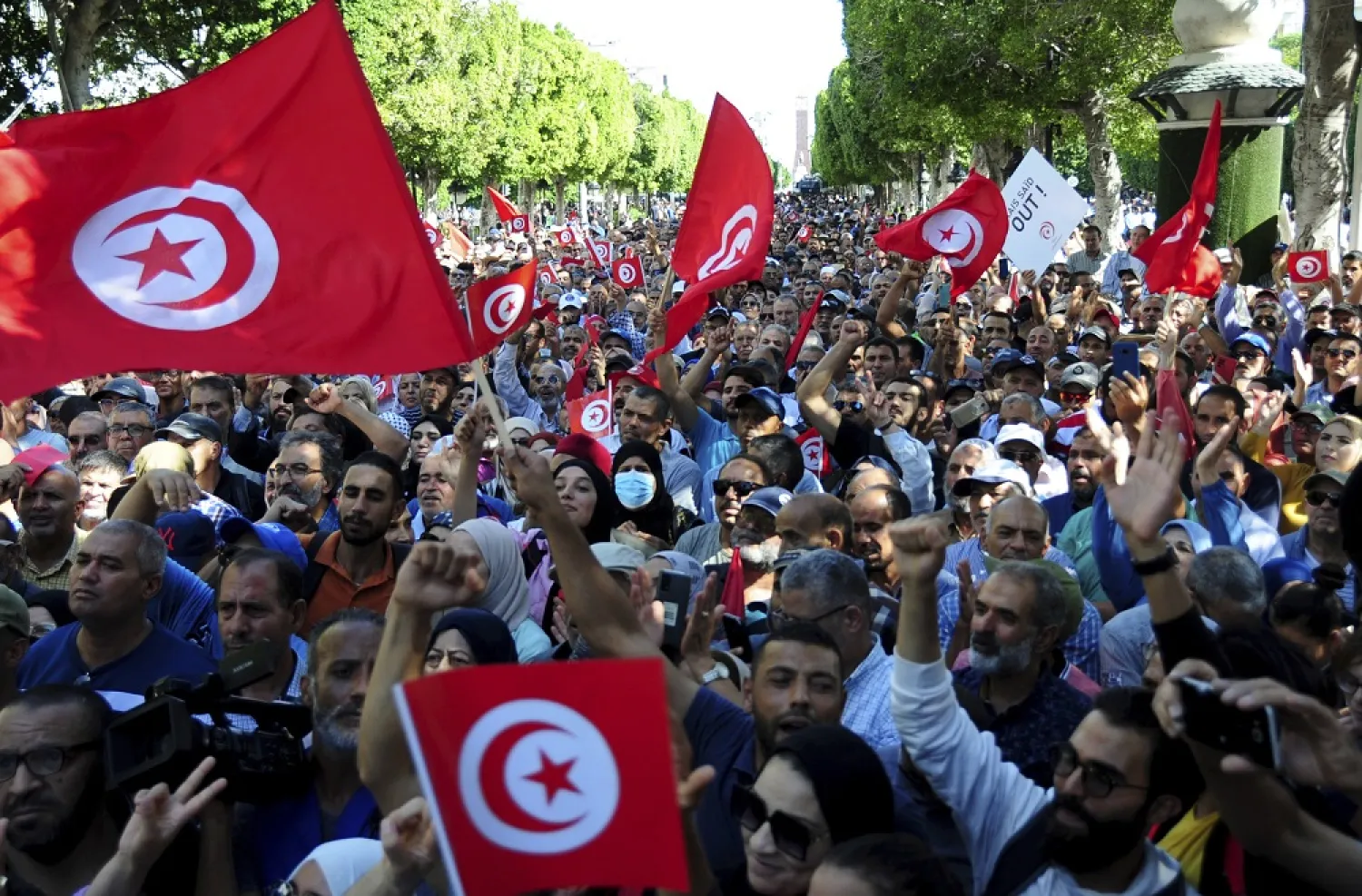 People take part in a demonstration by the National Salvation Front against President Kais Saïed at Avenue Habib Bourguiba in Tunis, Tunisia, Saturday Oct. 15, 2022.(AP)