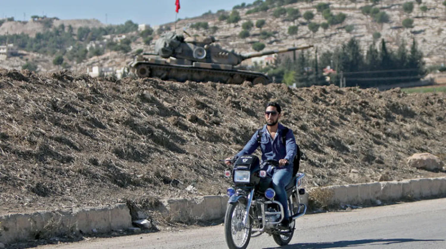 موقع للقوات التركية في ضواحي مدينة عفرين بشمال محافظة حلب أمس (أ.ف.ب)