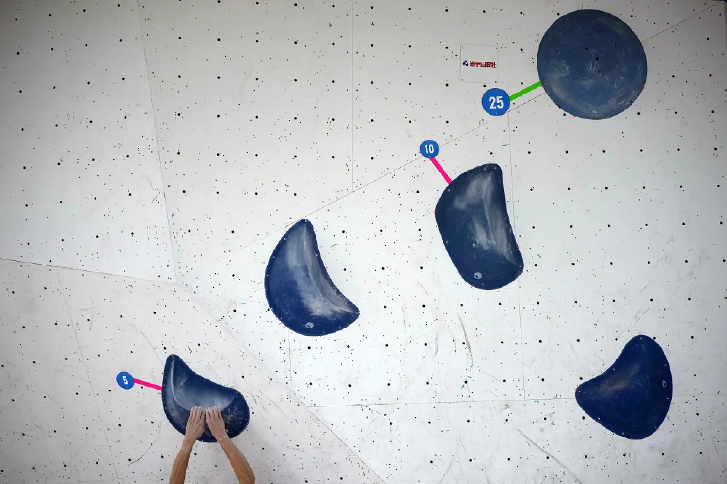 An athlete competes during the boulder semi-final of the IFSC Climbing World Cup Friday, Oct. 21, 2022, in Morioka, Iwate Prefecture, Japan. (AP)