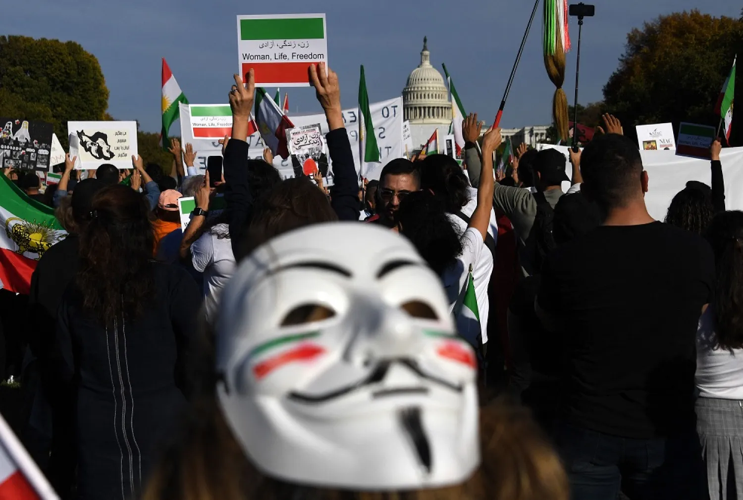 Protesters march in solidarity with protesters in Iran on the National Mall in Washington, DC, on October 22, 2022. (AFP)