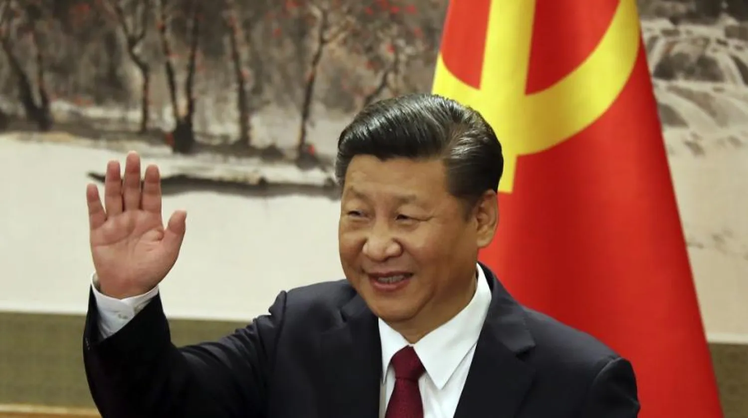 Chinese President Xi Jinping waves during a press event to introduce the new members of the Chinese Politburo at the Great Hall of the People in Beijing on Oct. 25, 2017. (AP)
