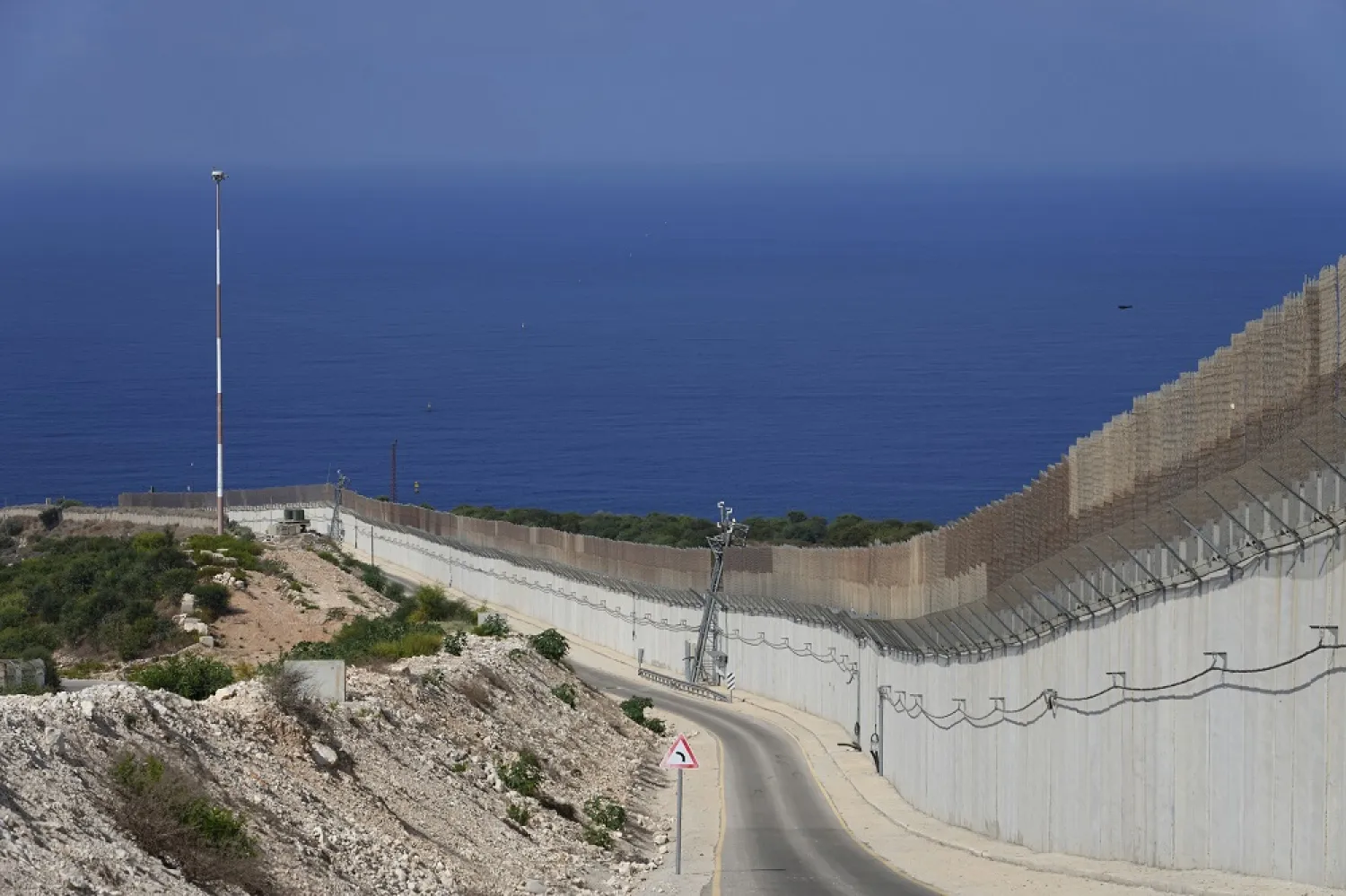 The wall on the Israeli border with Lebanon, seen at right, with the Mediterranean Sea in the distance, in Ras Hanikra, Israel, Friday, Oct. 14, 2022. (AP)