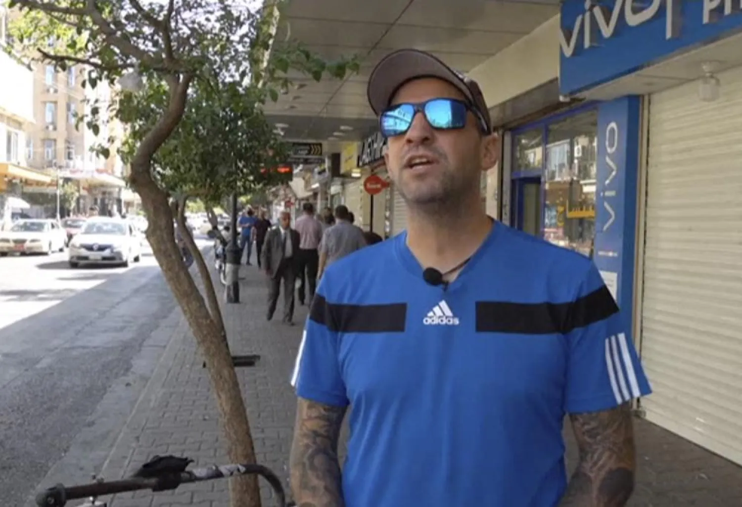 In this frame grab from video, 41-year-old Santiago Sánchez, a Spanish man who was documenting his travel by foot from Madrid to Doha for the 2022 FIFA World Cup, speaks to The Associated Press on a street, in Sulaymaniyah, Iraq, Sept. 28, 2022. (AP)