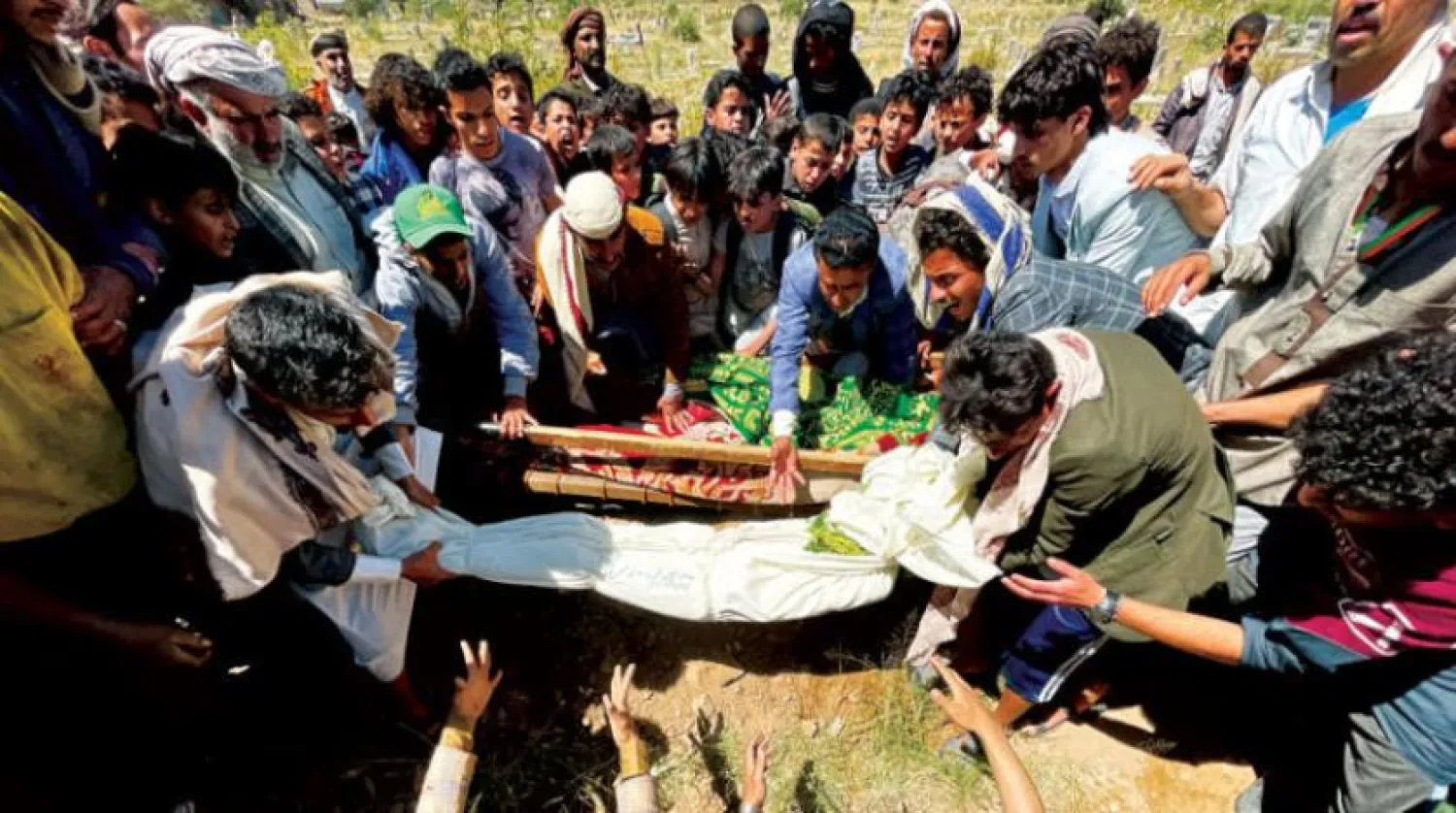 Mourners carry the body of a Yemeni child with cancer who died the day after receiving contaminated medicine in a hospital in Sanaa (Reuters)