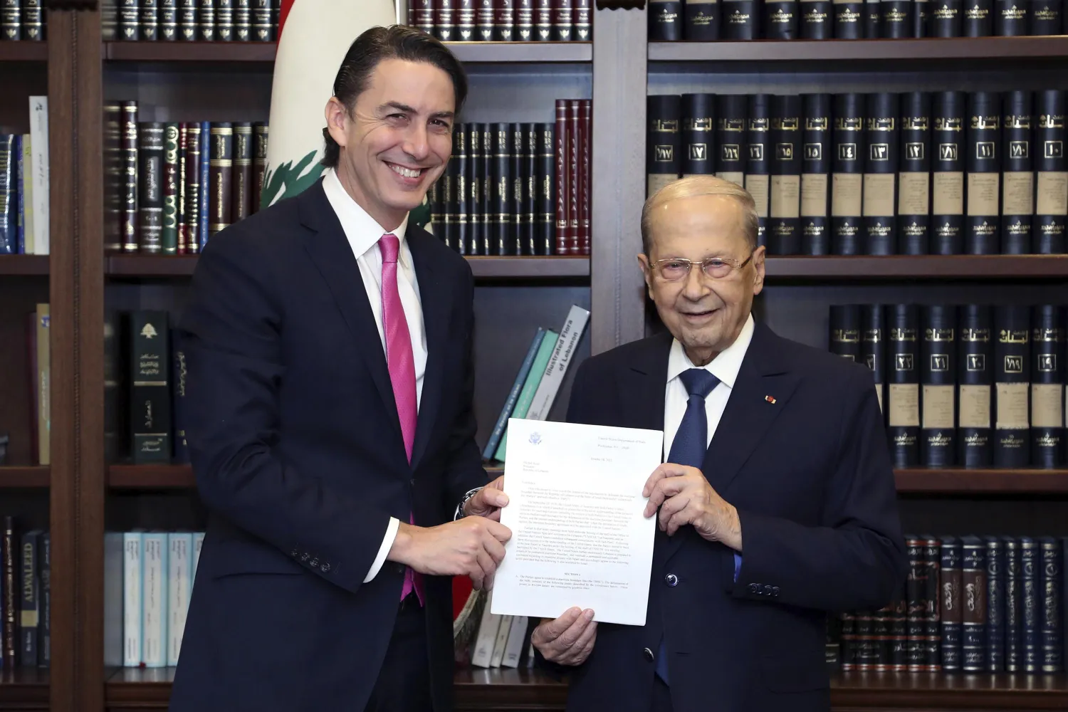 In this photo released by Lebanon's official government photographer Dalati Nohra, Lebanese President Michel Aoun, right, receives from US Envoy for Energy Affairs Amos Hochstein, the US-brokered deal setting a maritime border between Lebanon and Israel, at the presidential palace, in Beirut, Lebanon, Thursday, Oct. 27, 2022. (Dalati Nohra via AP)