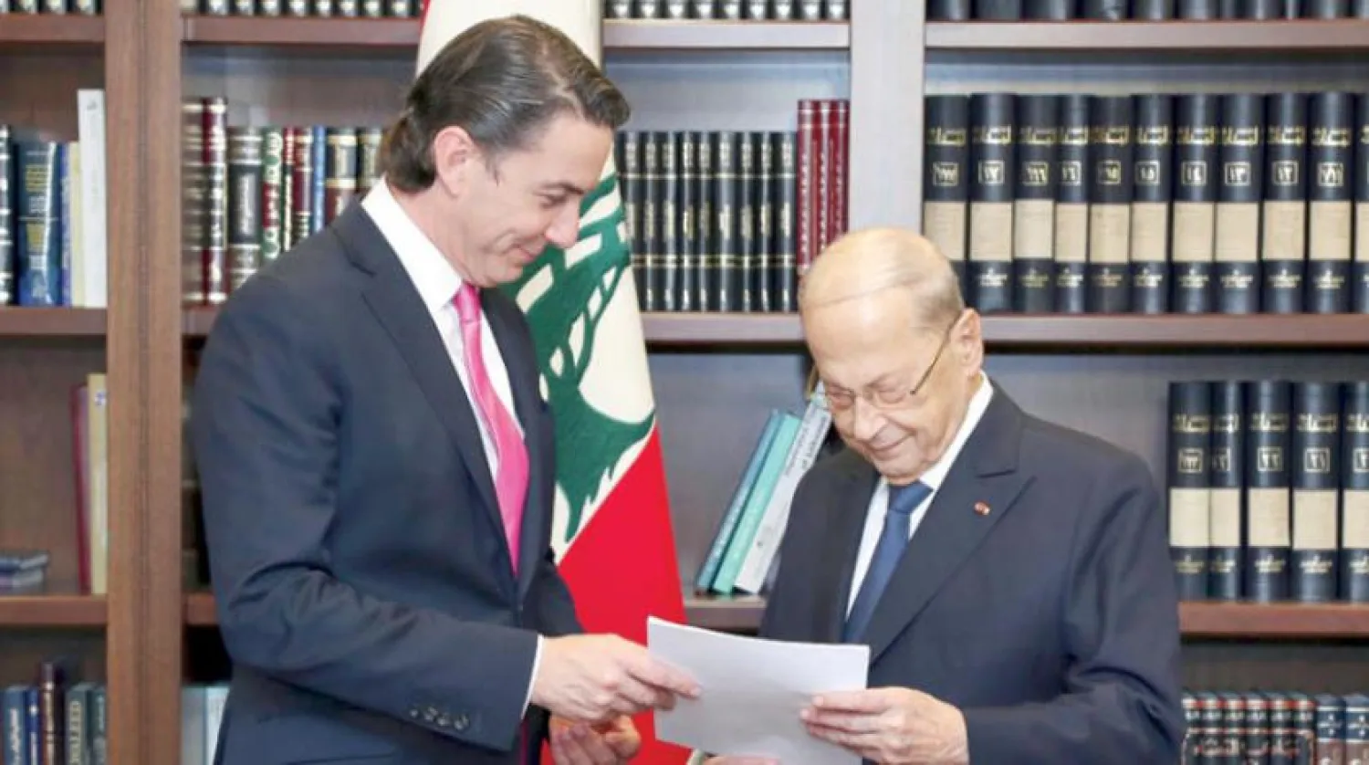 In this photo released by Lebanon's official government photographer Dalati Nohra, Lebanese President Michel Aoun, right, receives from US Envoy for Energy Affairs Amos Hochstein, the US-brokered deal setting a maritime border between Lebanon and Israel, at the presidential palace, in Beirut, Lebanon, Thursday, Oct. 27, 2022. (Dalati Nohra via AP)