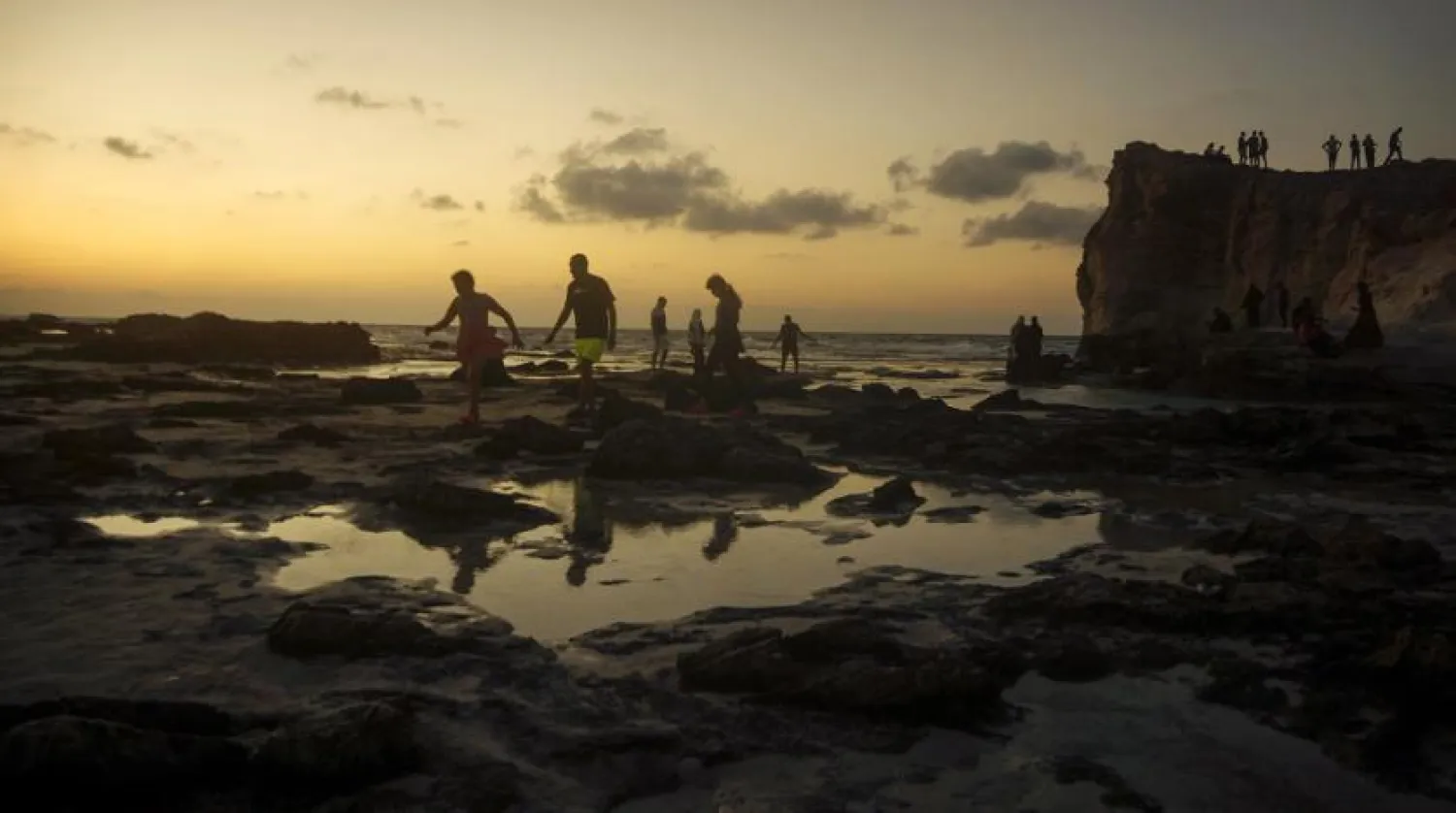 File Photo: Egyptians on holiday walk at Cleopatra Beach, in the Mediterranean city of Marsa Matrouh, 270 miles (430 kilometers) northwest of the capital, Cairo, Egypt, Wednesday, Aug. 10, 2022. (AP)

