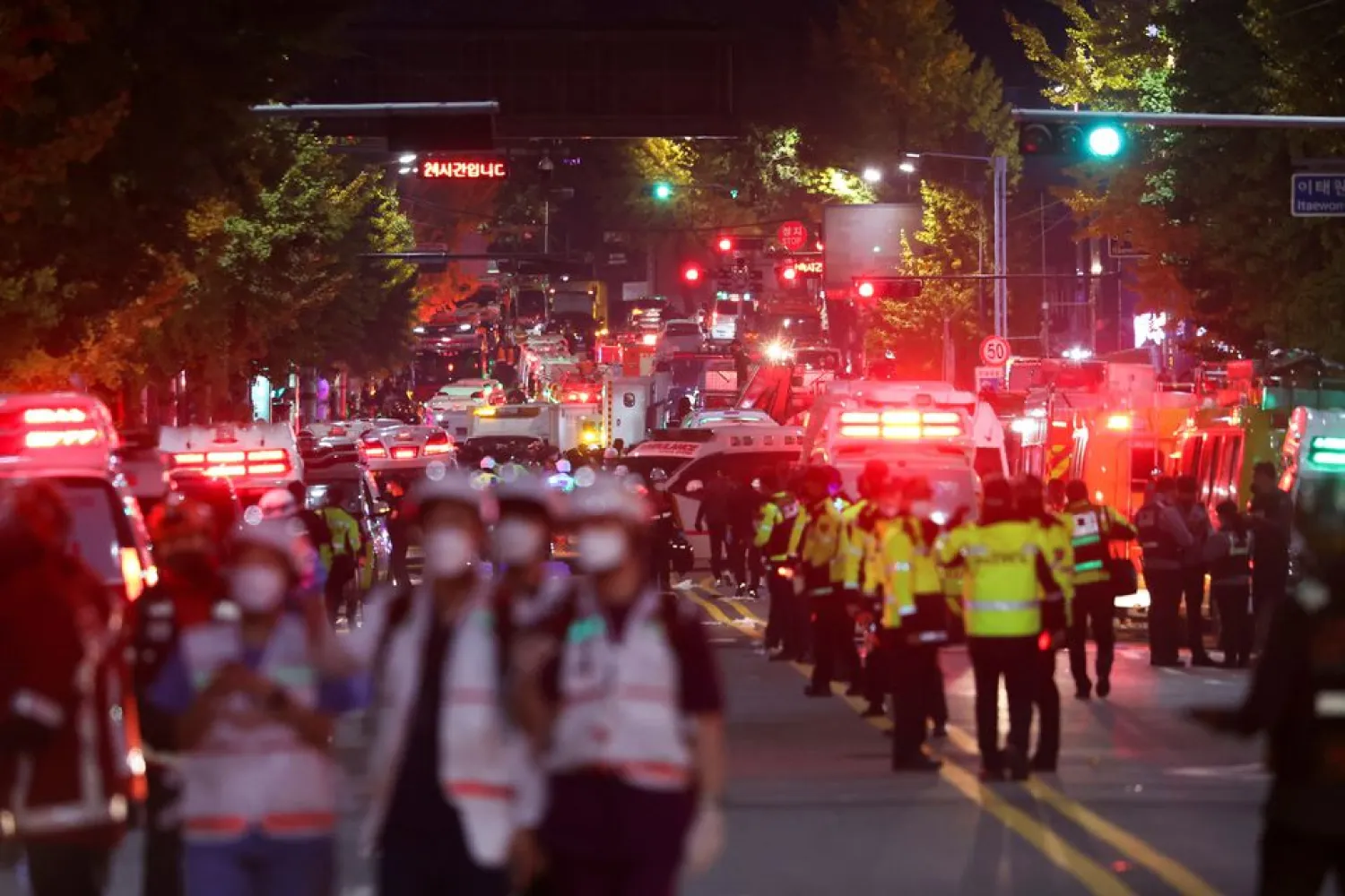 Rescue teams work at the scene where dozens of people were injured in a stampede during a Halloween festival in Seoul, South Korea, October 30, 2022. REUTERS/Kim Hong-ji