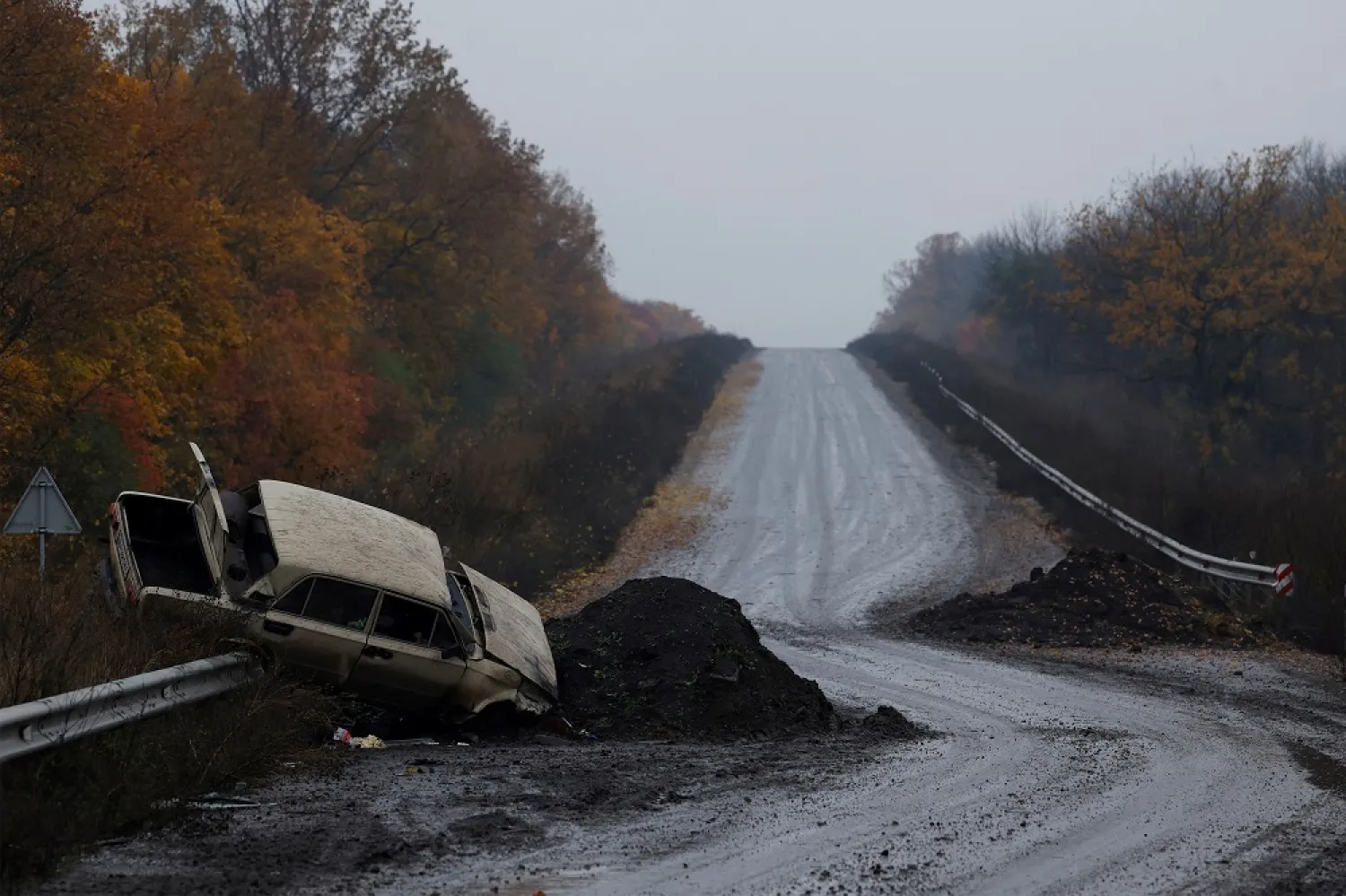 A destroyed car is seen on the main road, as Russia's invasion of Ukraine continues, in the eastern Donbas region of Bakhmut, Ukraine, October 30, 2022. (Reuters)