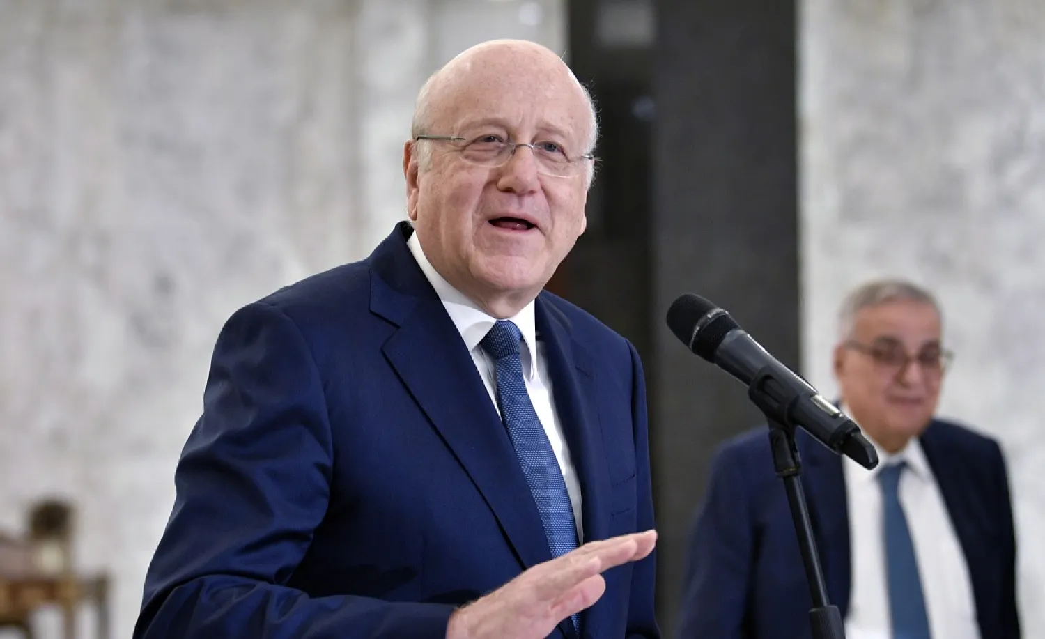 Lebanese caretaker Prime Minister Najib Mikati speaks during a news conference after a meeting with Lebanese President Michel Aoun (not pictured) at the presidential palace in Baabda, Lebanon, 11 October 2022. (EPA)