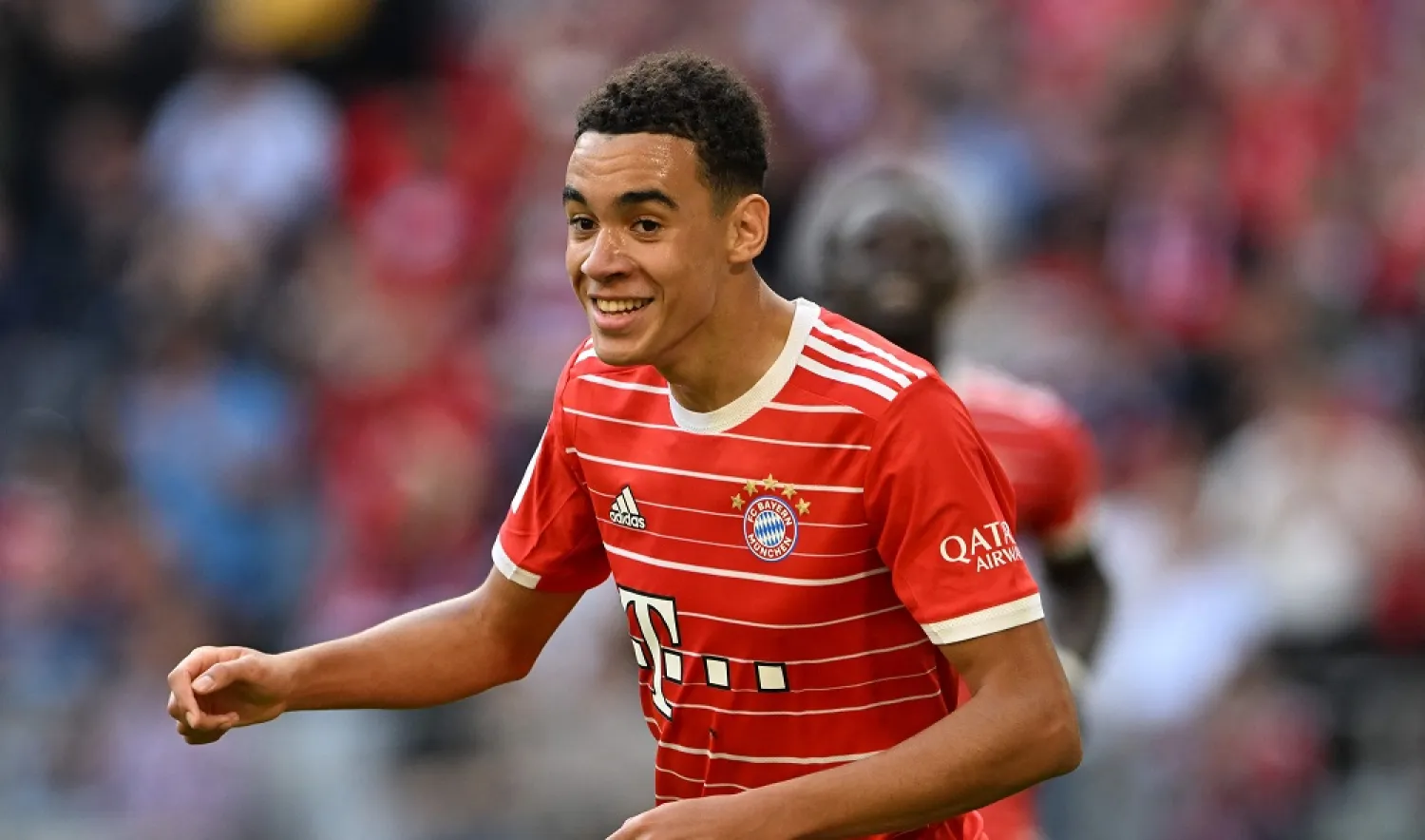 Bayern Munich's German midfielder Jamal Musiala celebrates after scoring the 2-0 goal during the German first division Bundesliga football match Bayern Munich v Mainz 05 in Munich, southern Germany on October 29, 2022. (AFP)